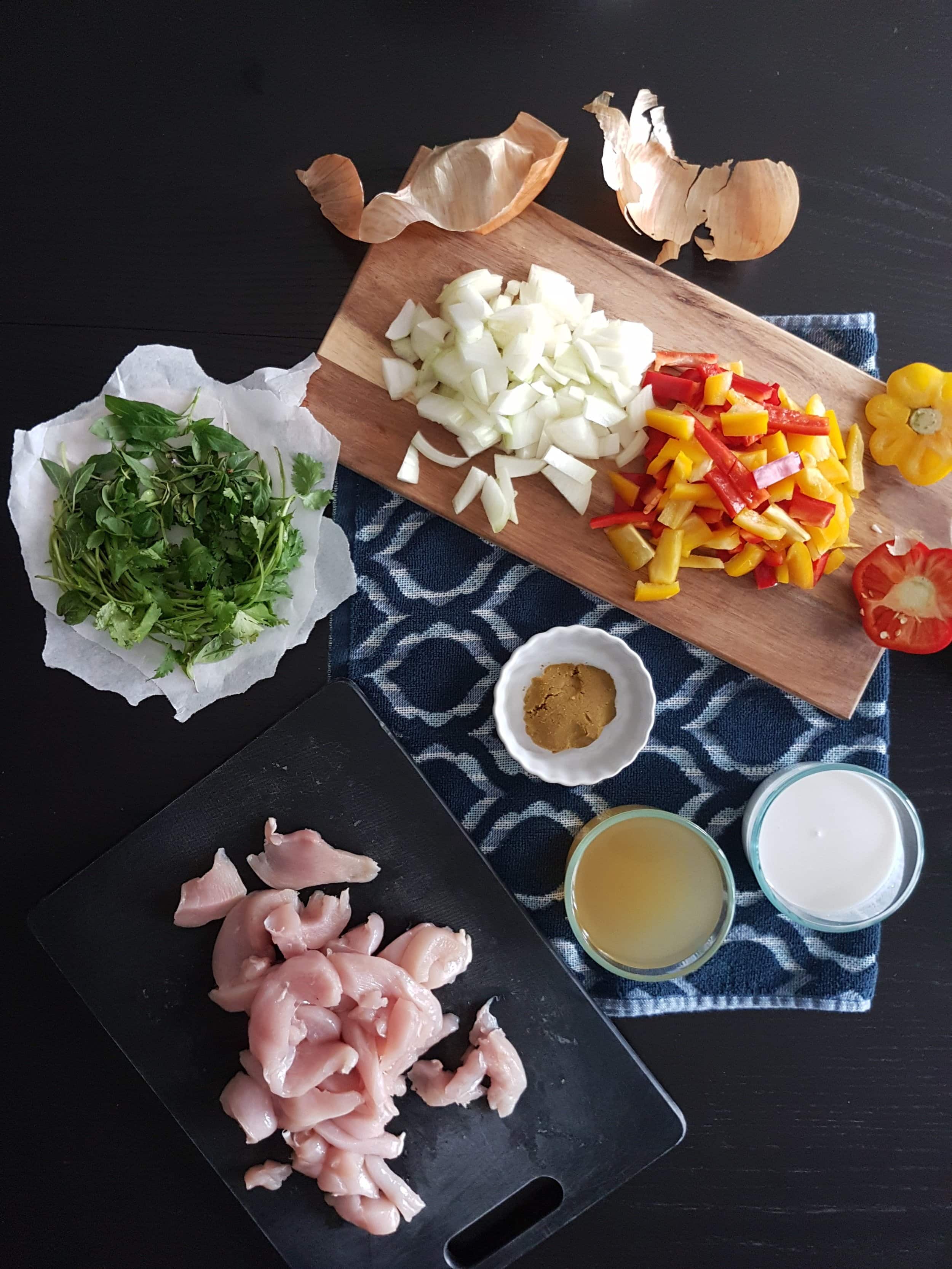 Chicken, peppers, onions, stock, curry paste,coconut milk, and cilantro.