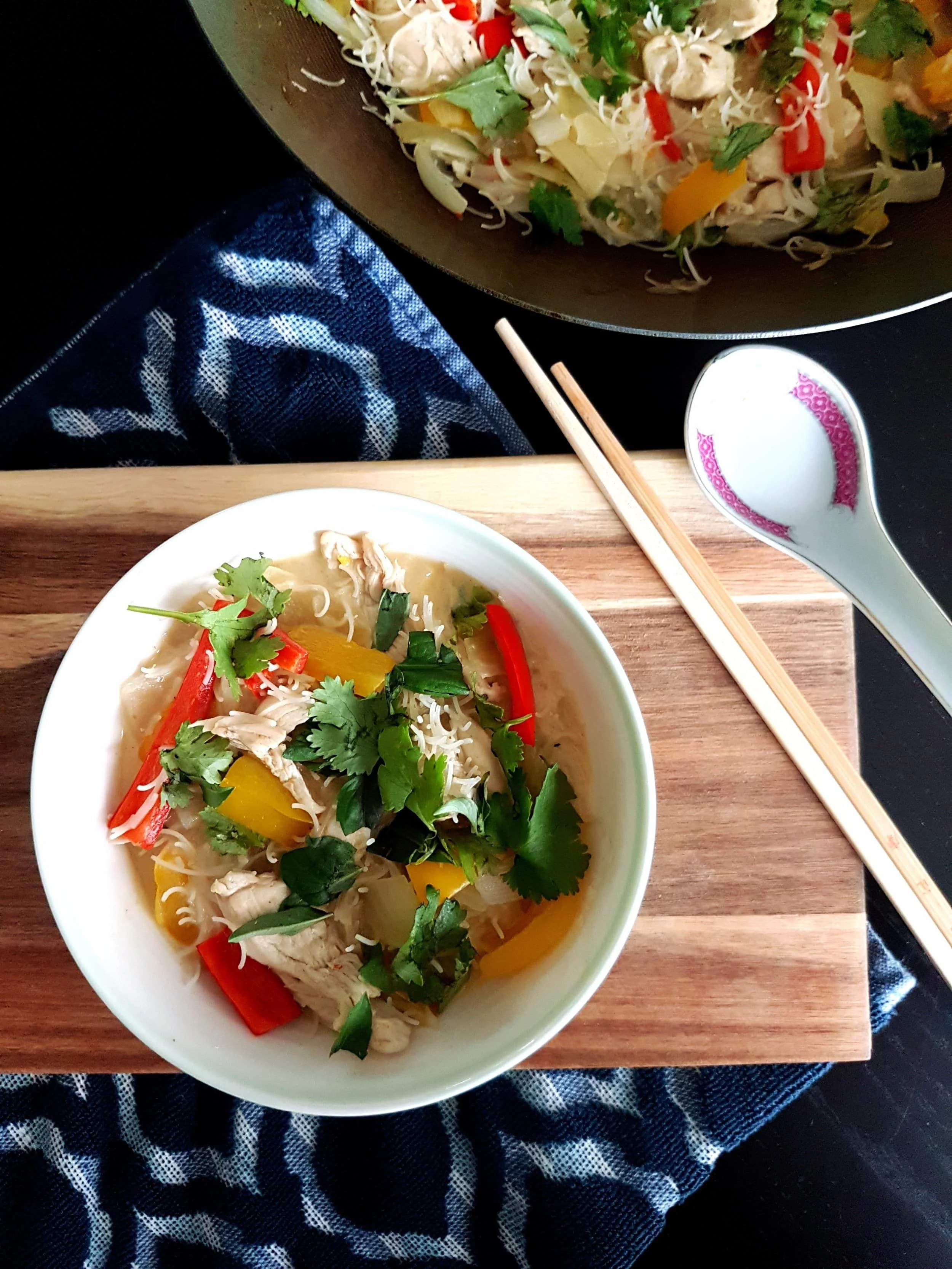 A bowl of Thai Green Coconut Curry Chicken with Rice Noodles.
