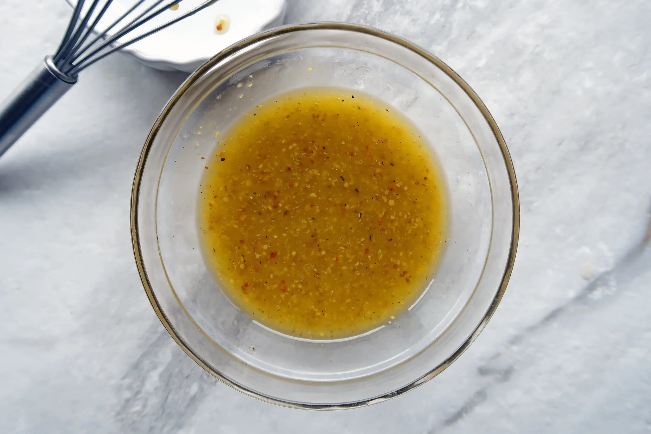 A bowl of apple cider vinaigrette.