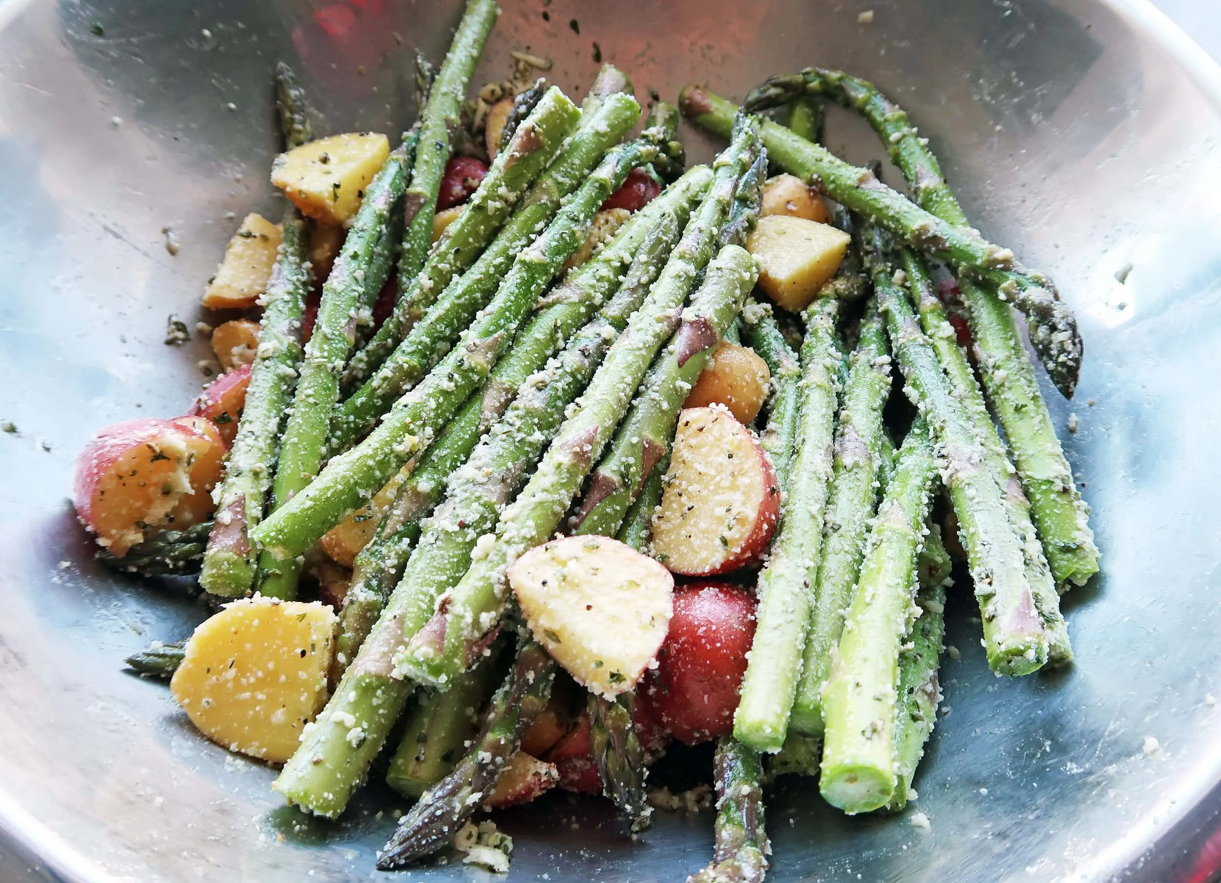 Potatoes and asparagus in a bowl.