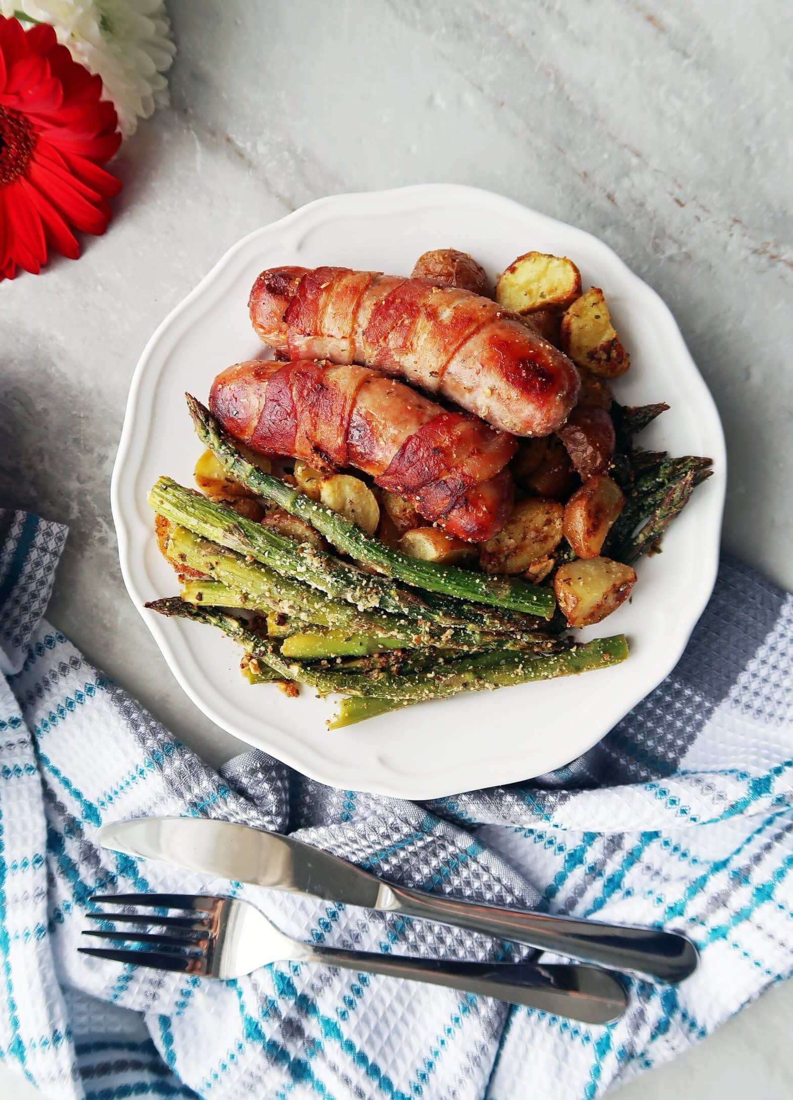 BaconWrapped Sausages with Garlic Parmesan Asparagus and Potatoes