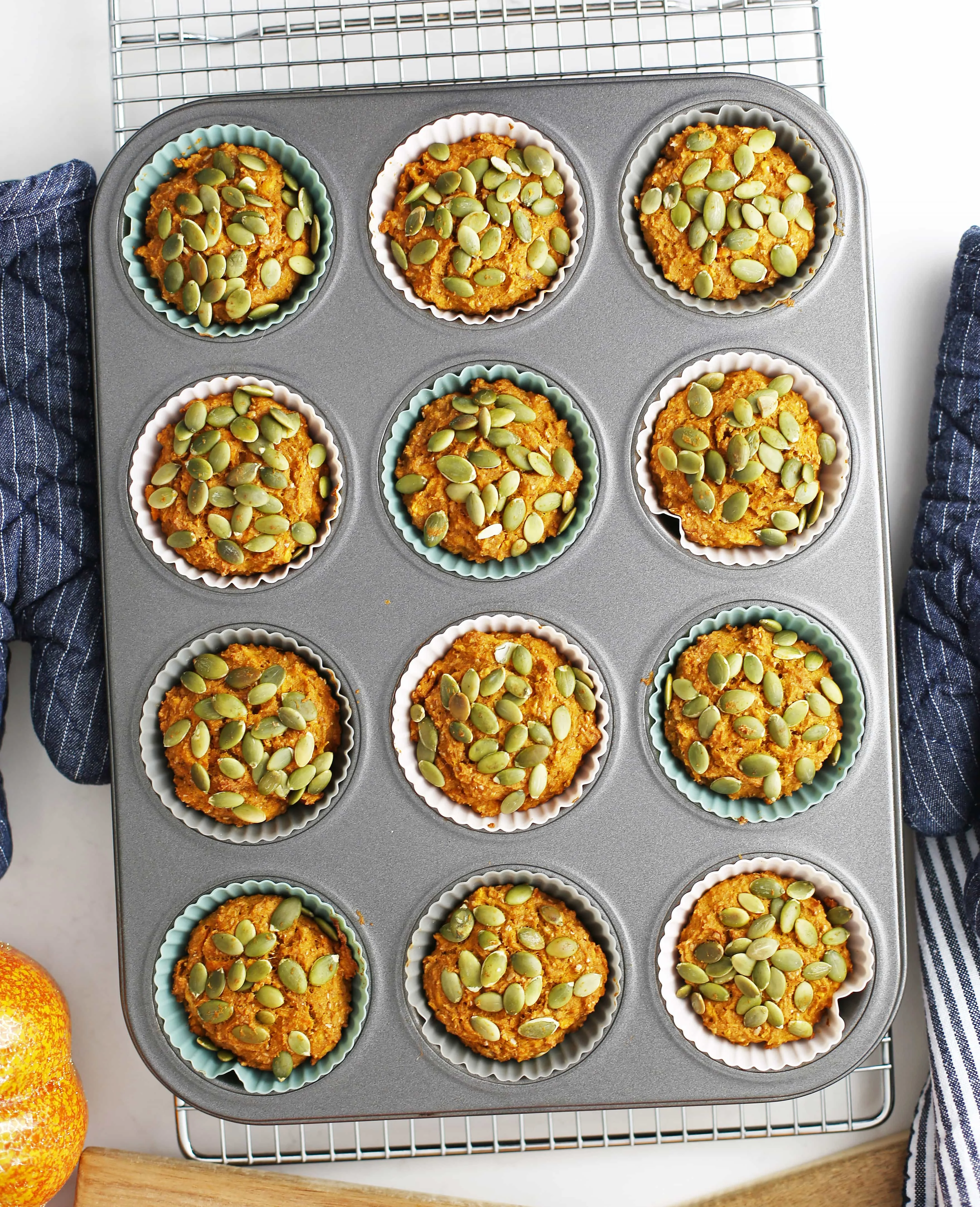 Overhead view of freshly baked healthy carrot pumpkin muffins.