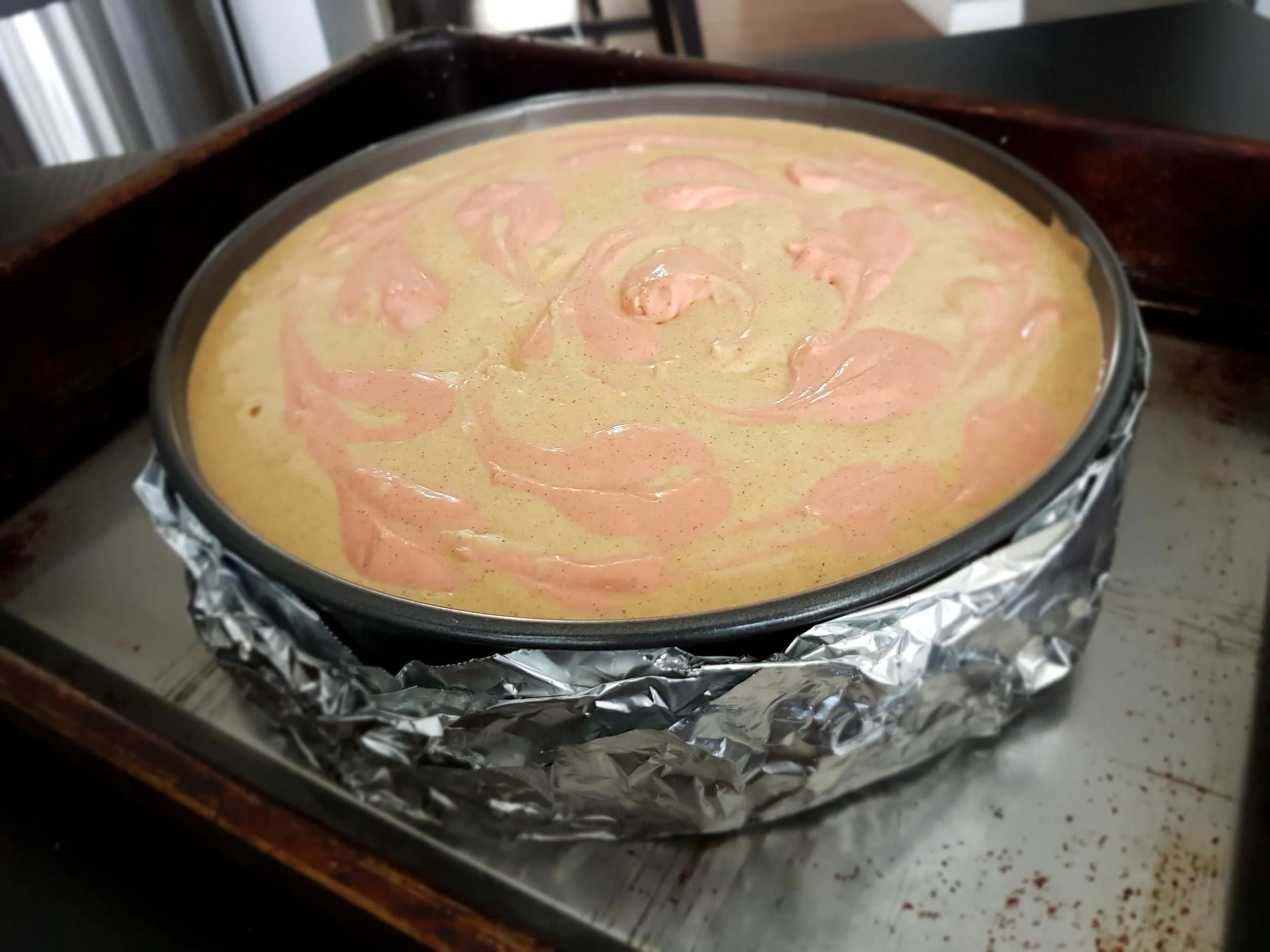 Baked Pumpkin Cheesecake in a water bath, ready for the oven.