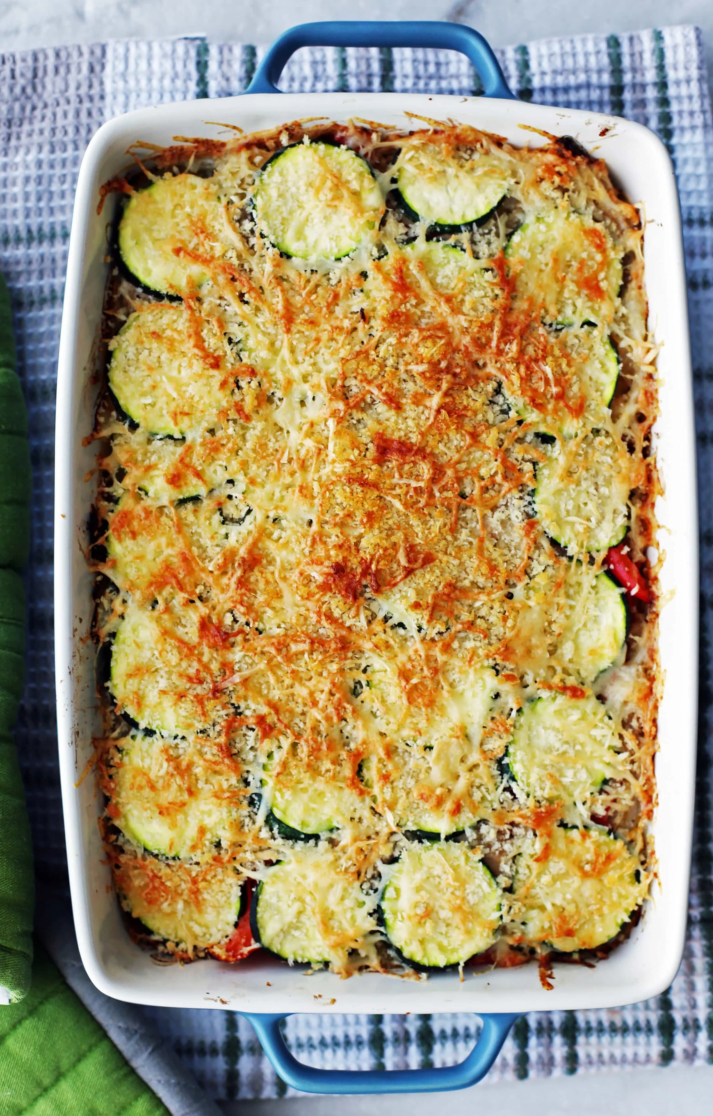 Baked Zucchini Gratin with Gruyère and Panko Breadcrumbs in a large rectangular casserole dish.