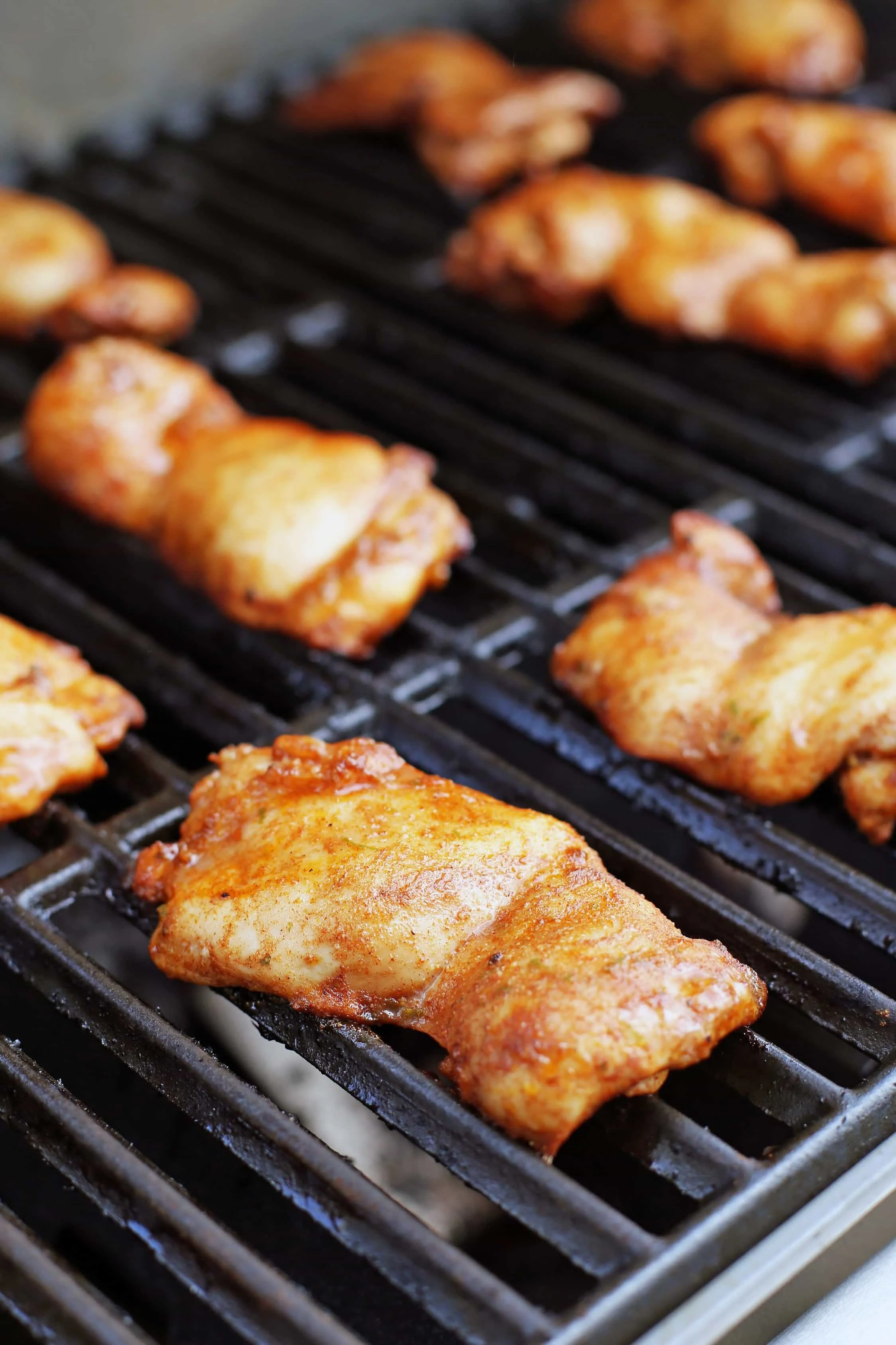 Marinated chili lime boneless skinless chicken thighs on a hot grill.