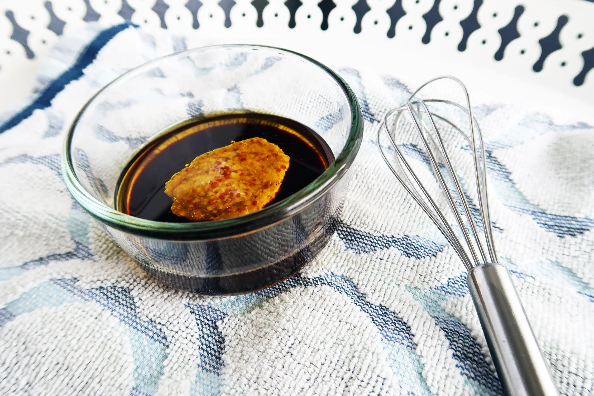 Balsamic vinegar and honey mustard in a bowl.