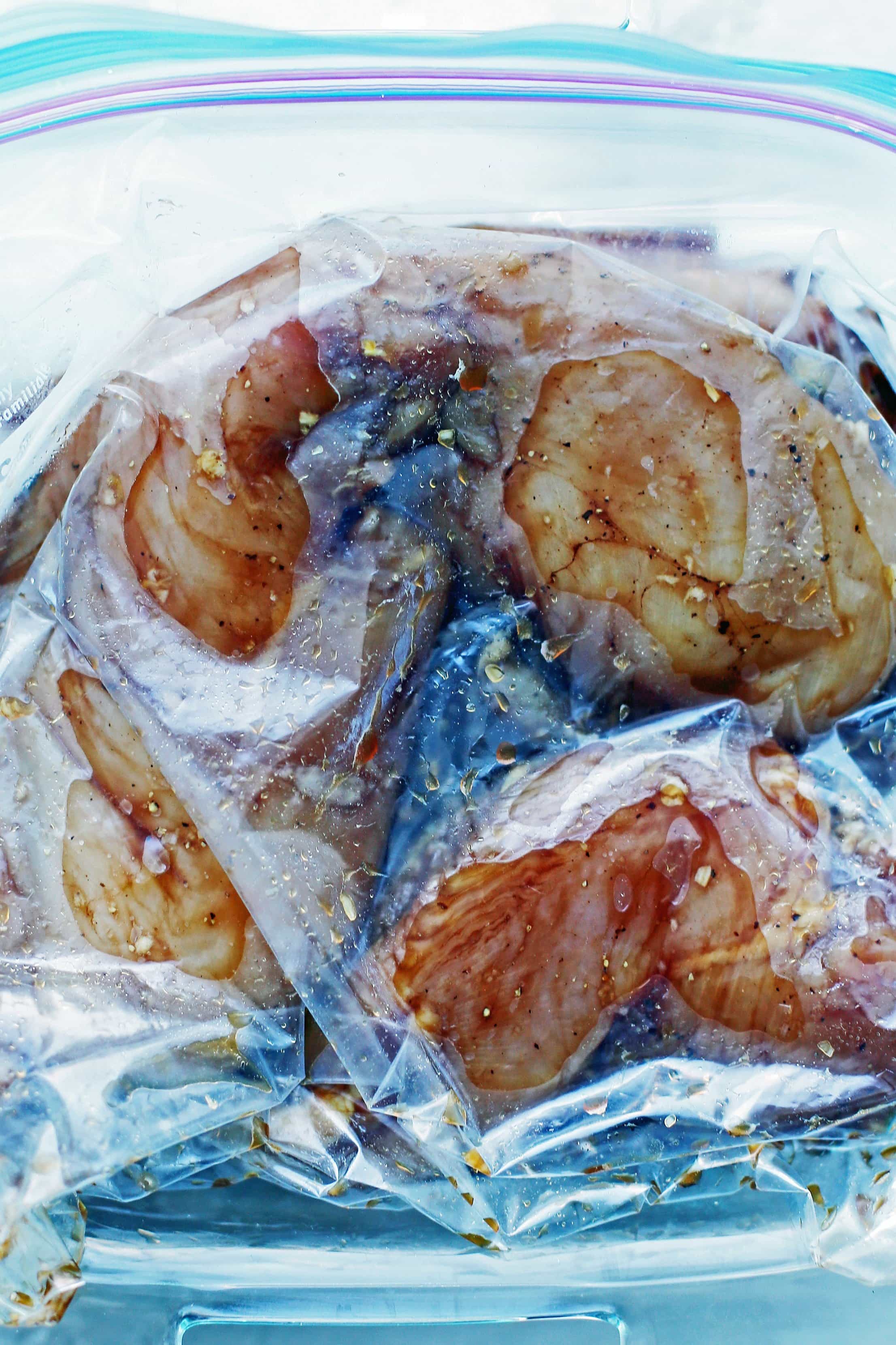Four chicken breasts and balsamic marinade a large Ziploc (resealable) bag.