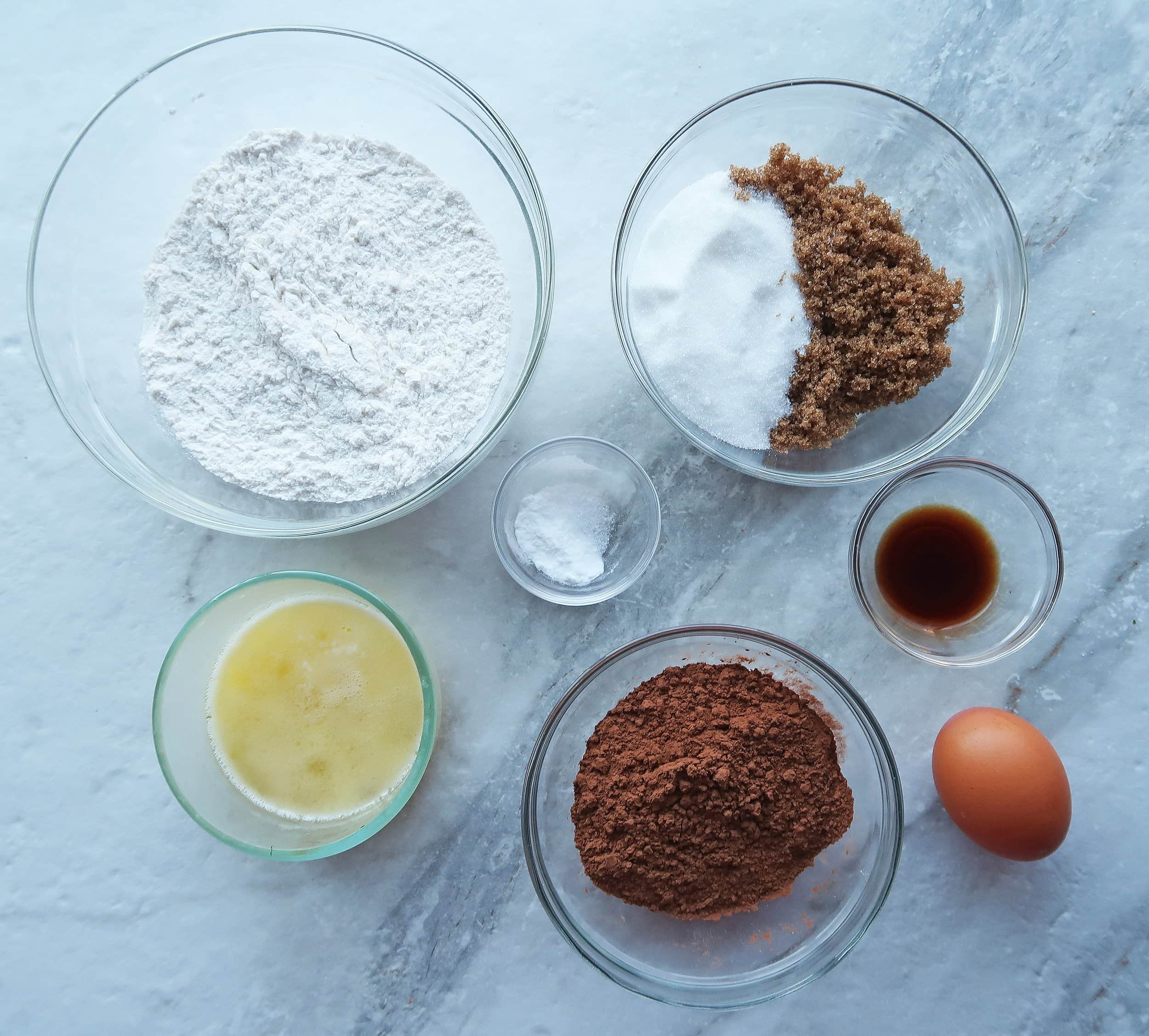 Flour, sugar, cocoa powder, butter, eggs, and vanilla.