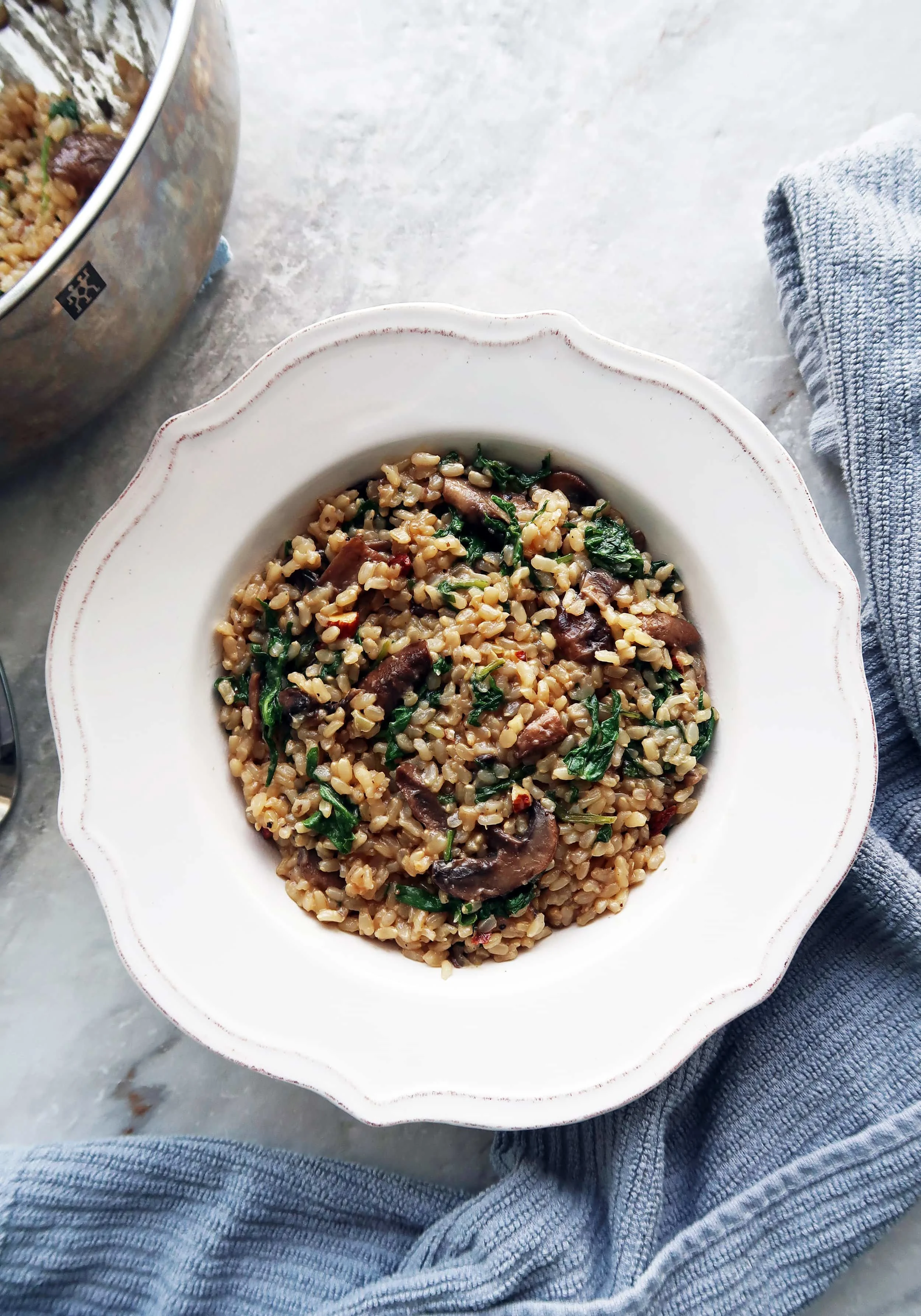 A bowl of Brown Rice Pilaf with Mushrooms, Kale, and Almonds