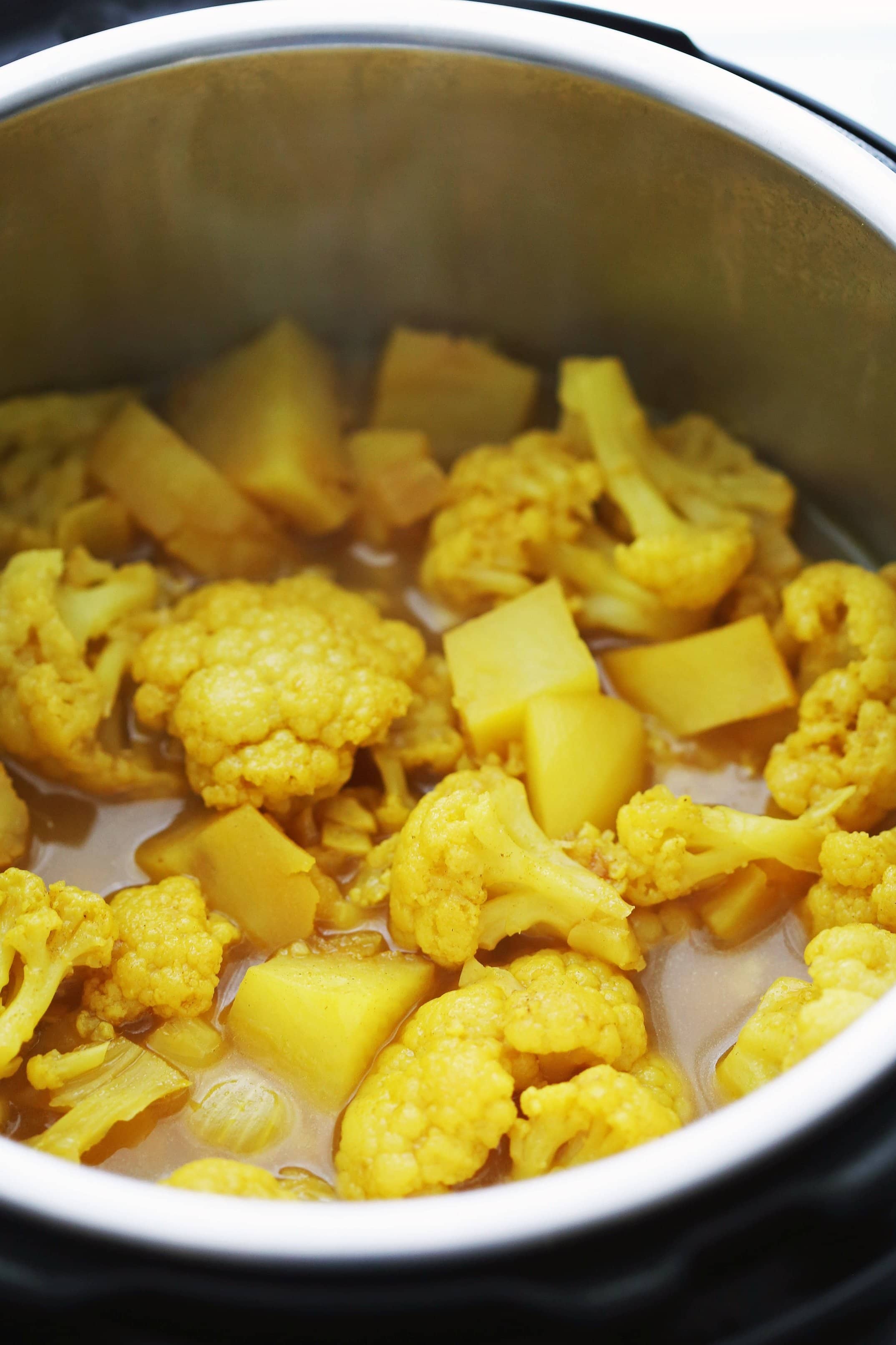 Turmeric cauliflower potato soup ready to be blended smooth in the Instant Pot.