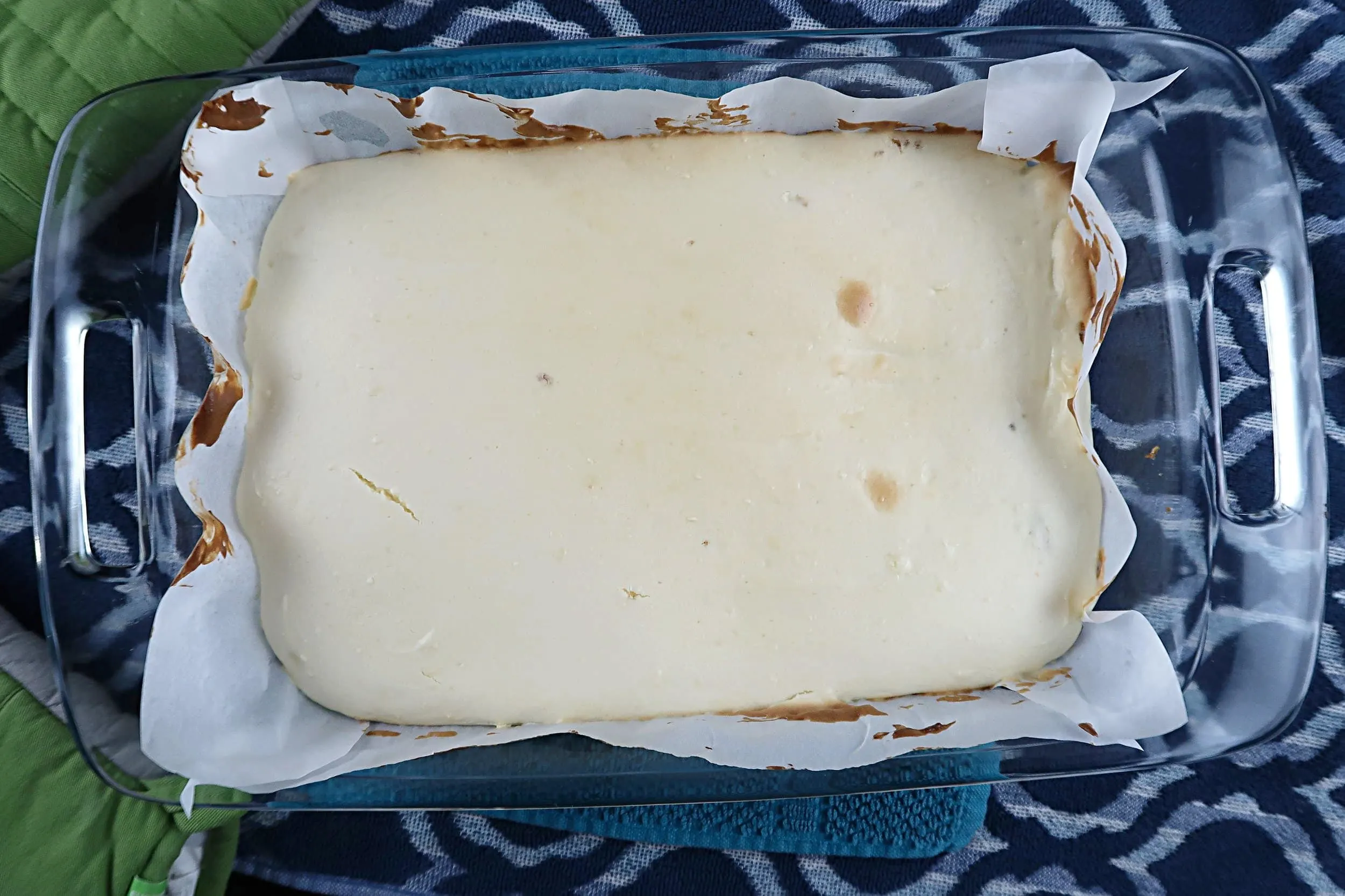 Cheesecake filing in a glass baking dish.