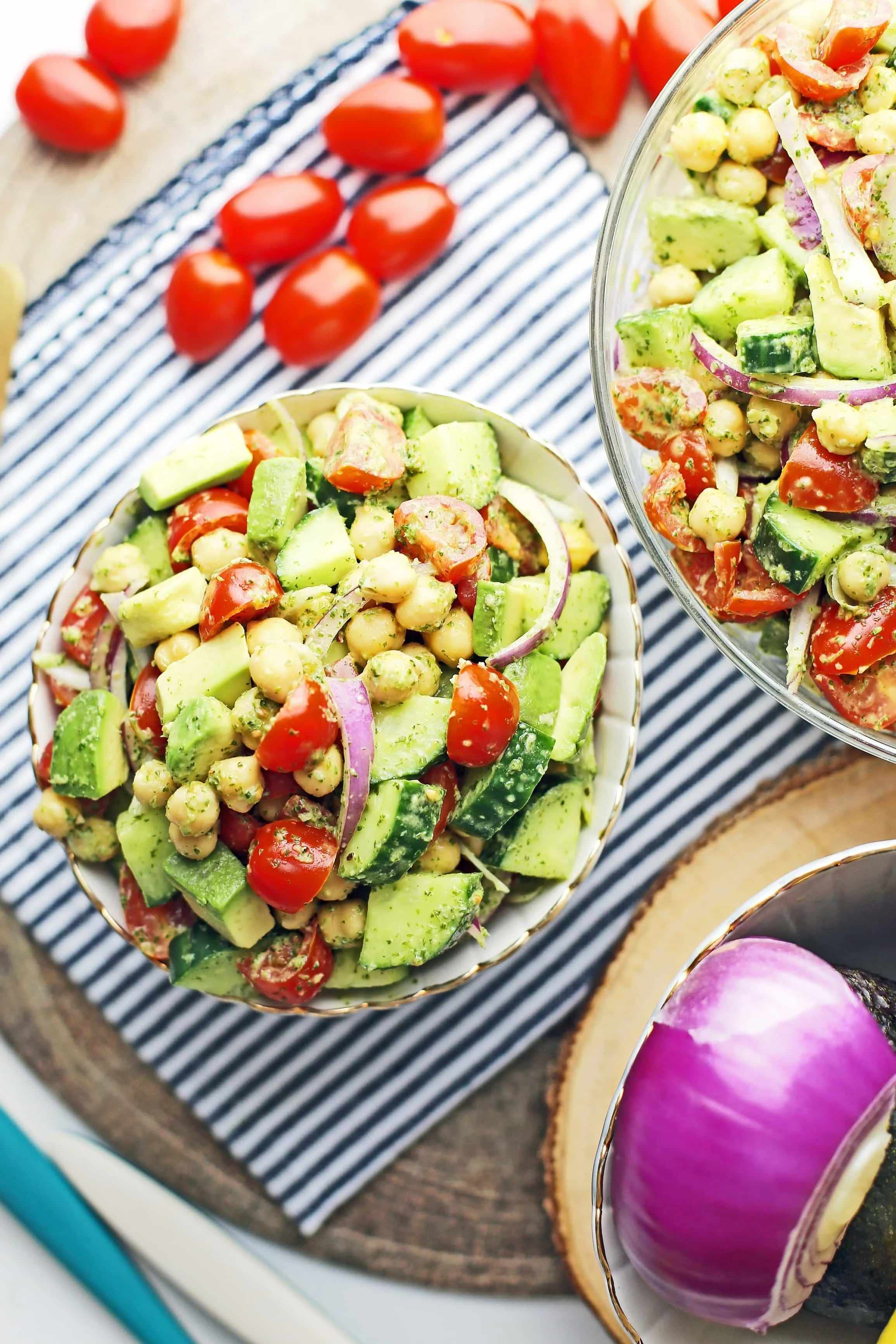 Overhead view of Chickpea Cucumber Avocado Salad with Parsley Dressing in a white and blue bowl.