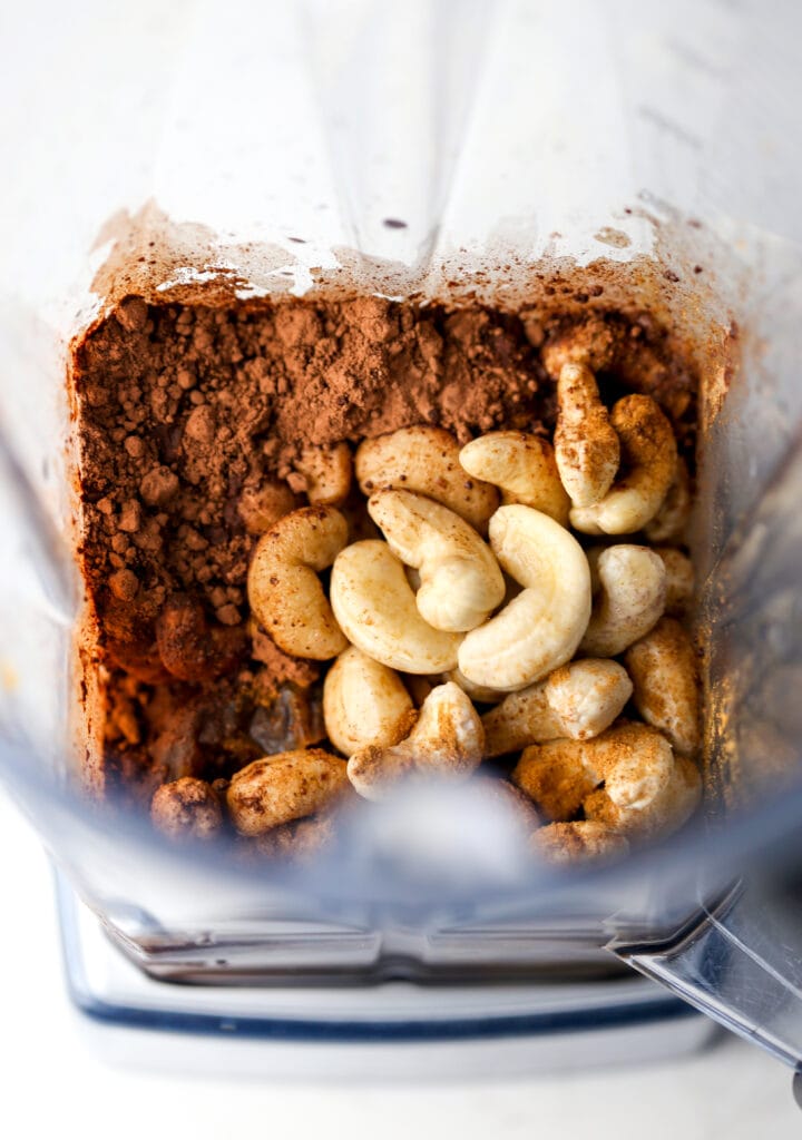 Overhead view of vegan chocolate dip ingredients in a blender container.