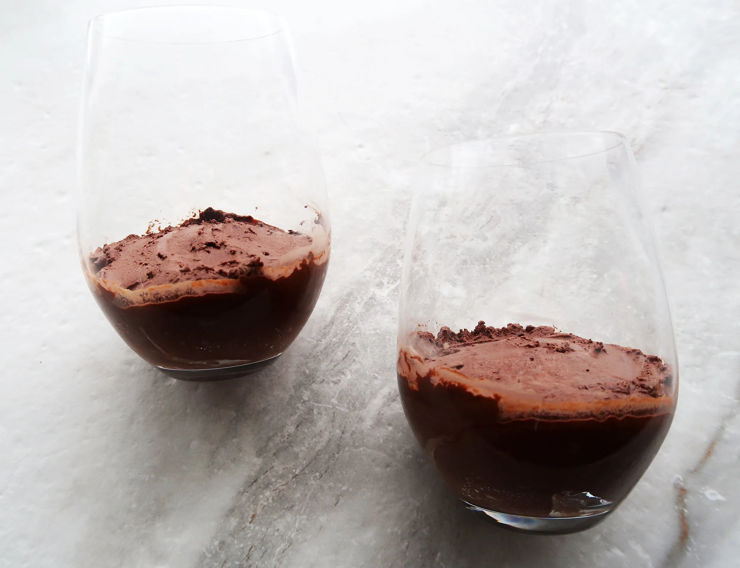 Dark chocolate mousse in two glasses.