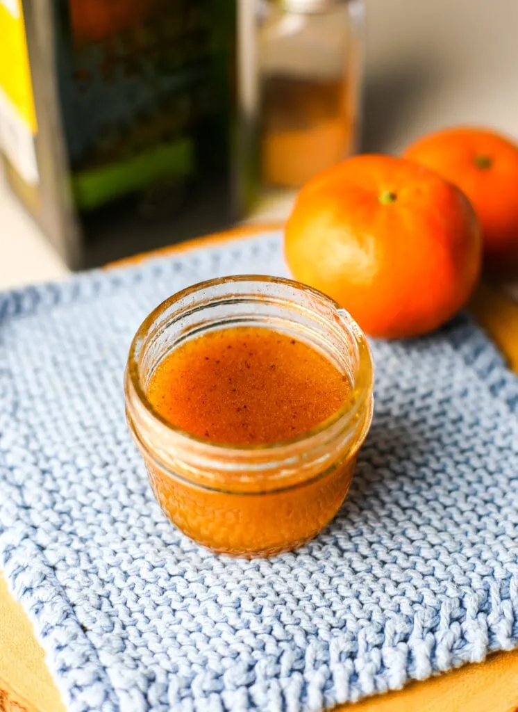 Cinnamon maple orange dressing in a small mason jar.