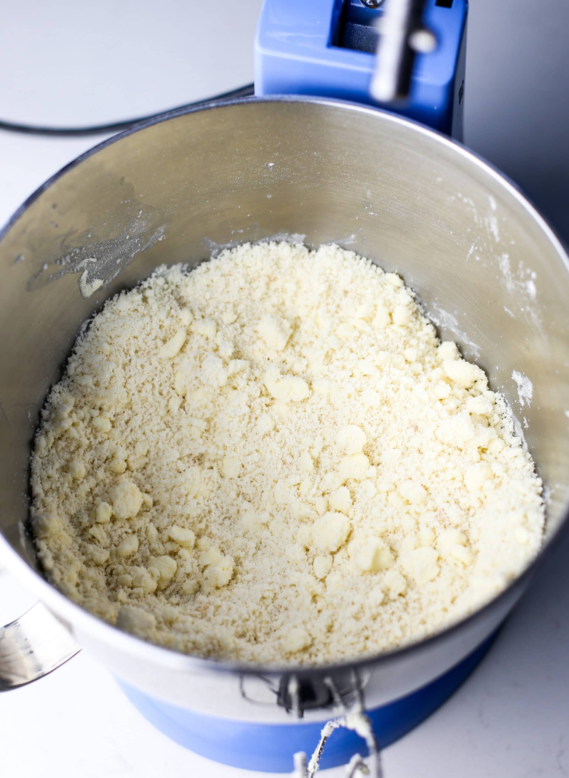 Condensed milk cookie ingredients partially combined in a mixing bowl.