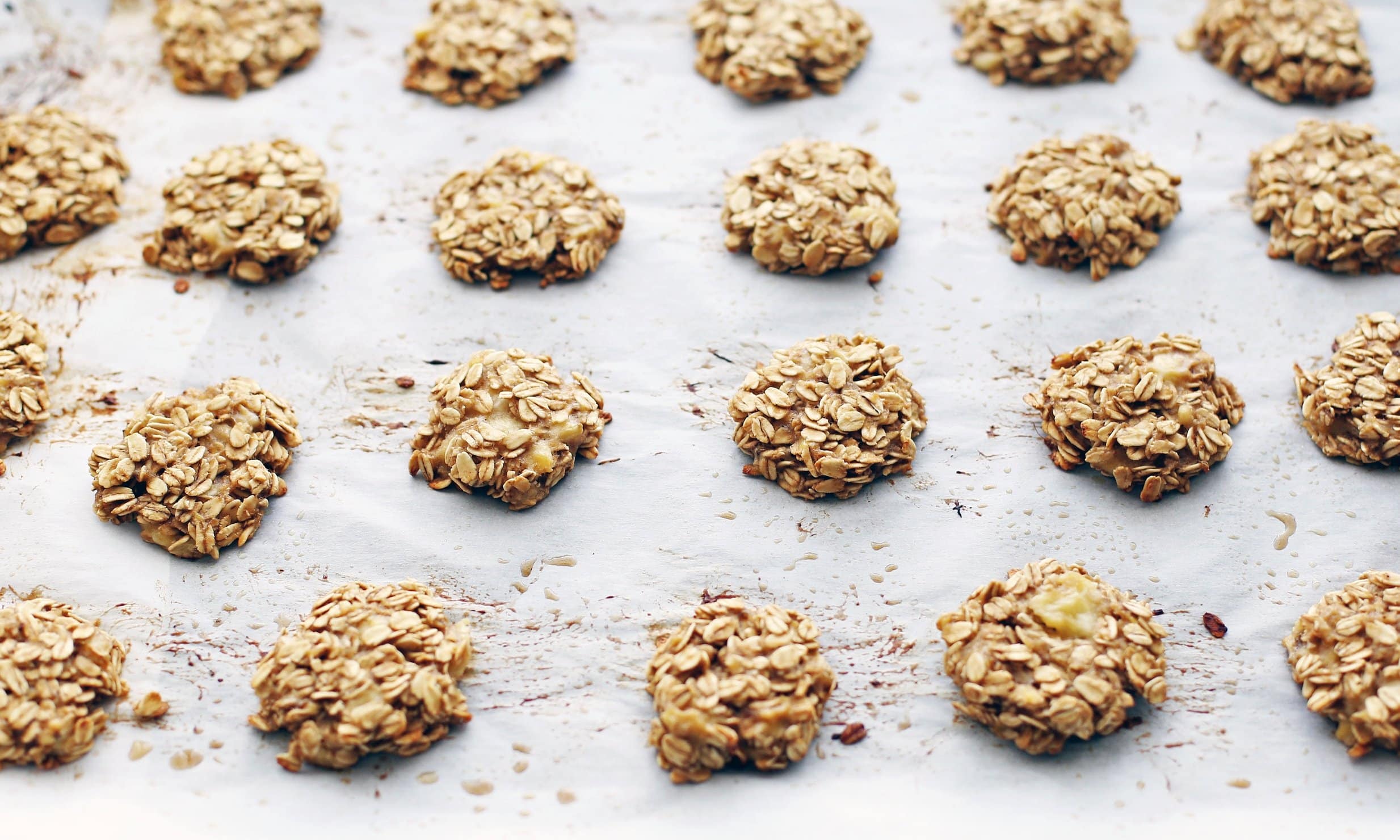 Oatmeal banana cookies on a baking sheet.