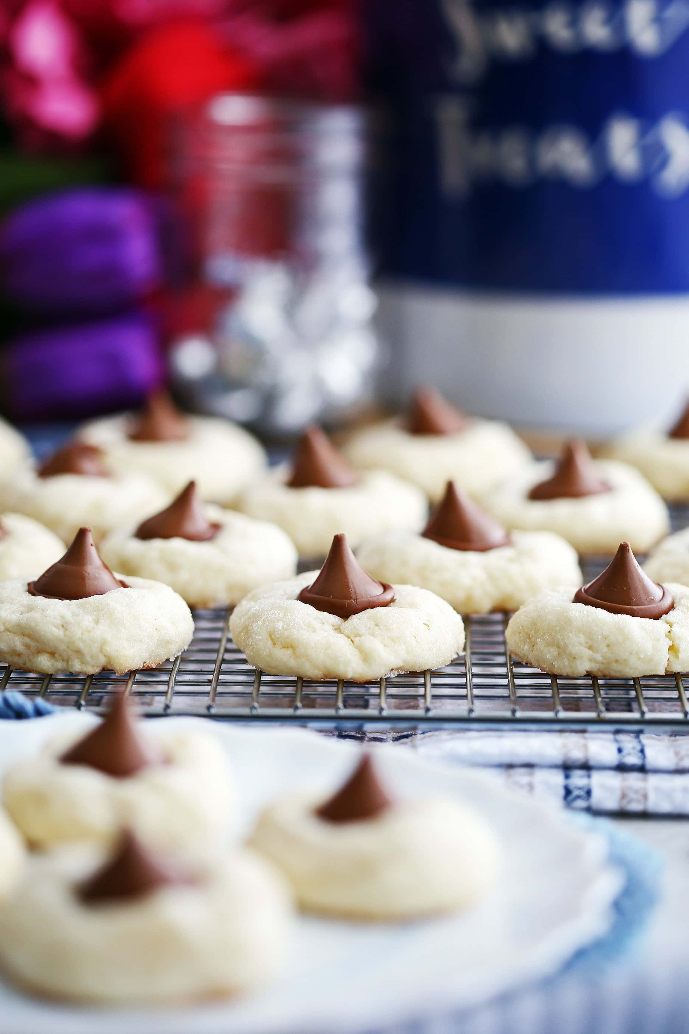 A side view of Cream Cheese Kiss Cookies on a metal cooling rack.