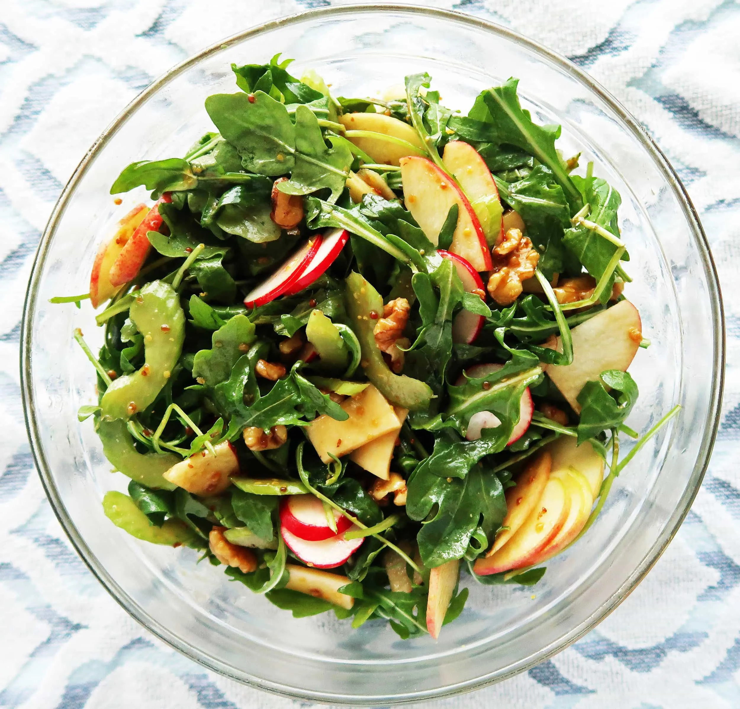 Arugula, celery, apple, and walnut salad tossed with balsamic honey mustard dressing.