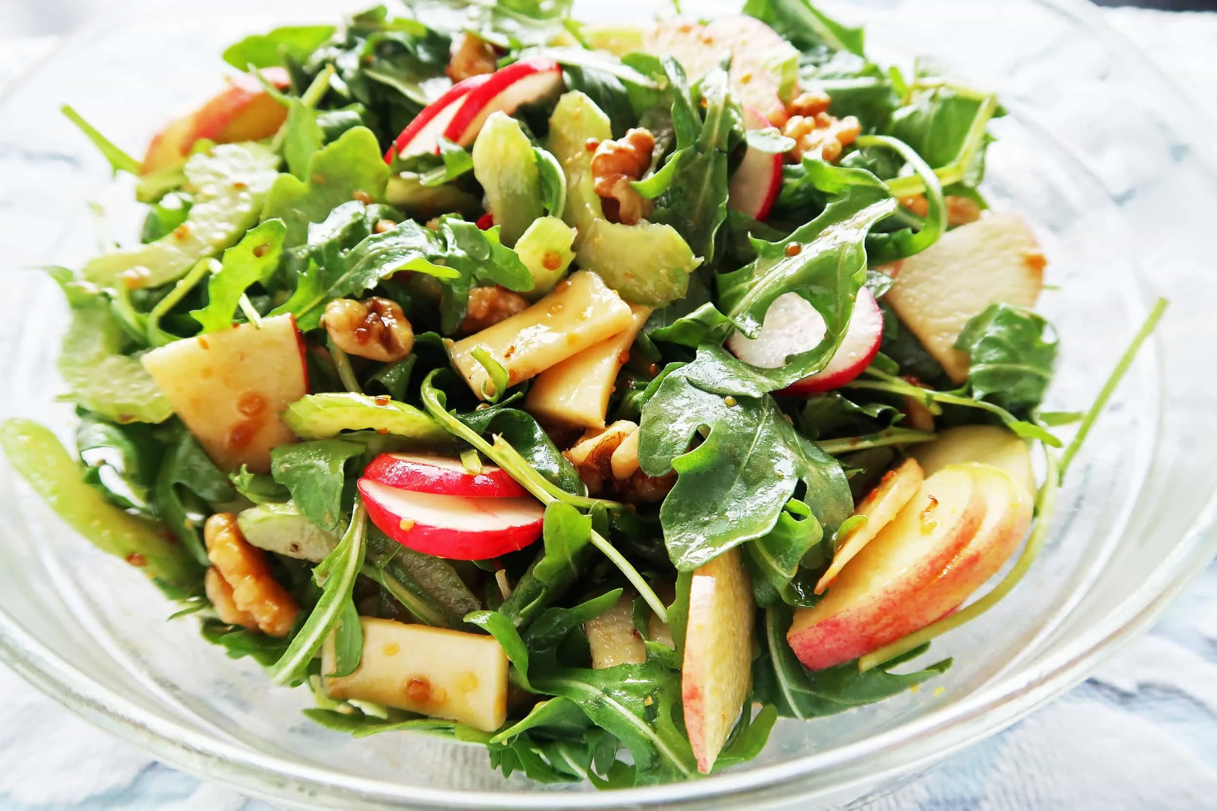 A bowl of Crunchy Winter Salad with Balsamic Honey Mustard Dressing