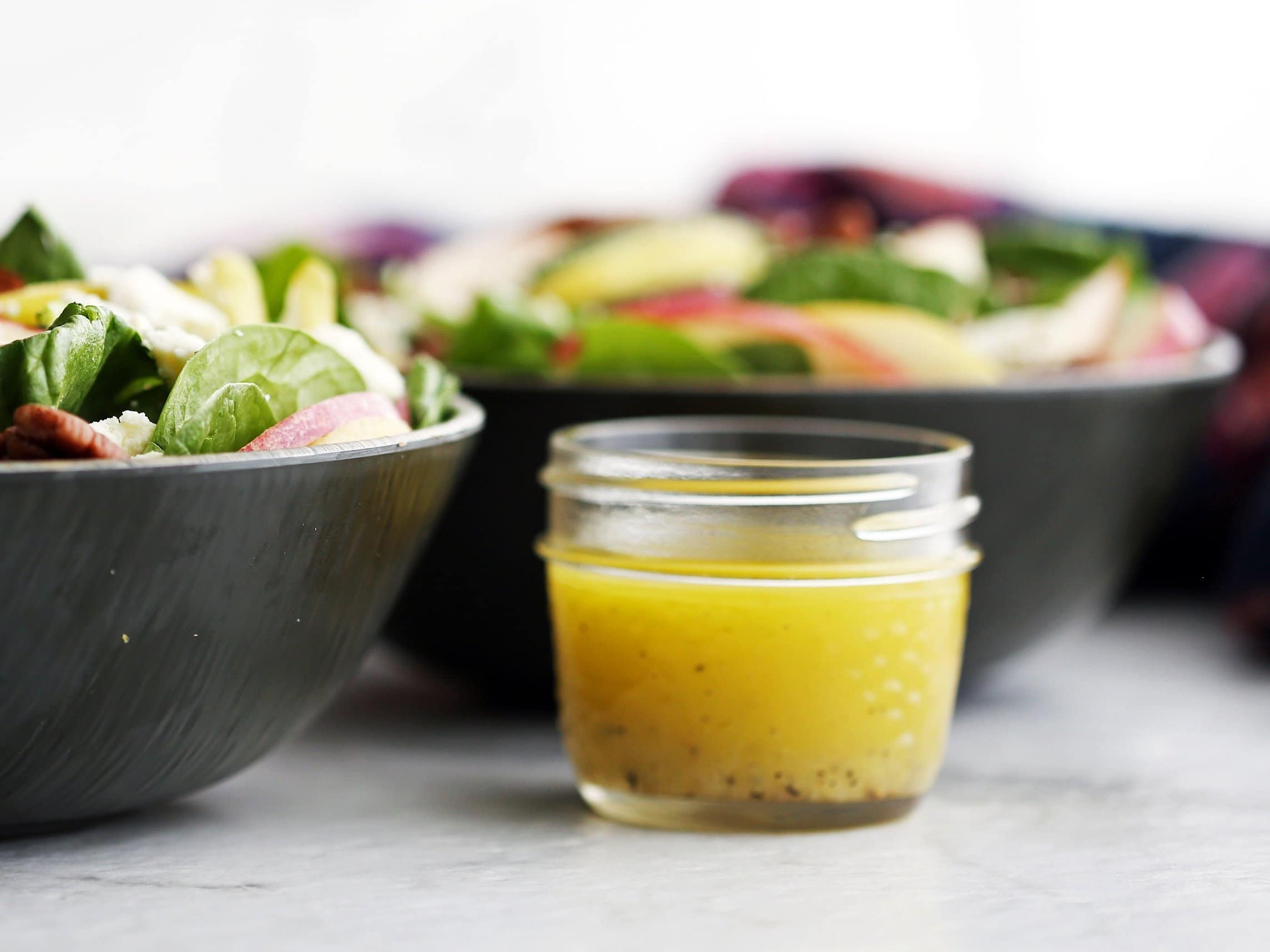 Honey lemon ginger vinaigrette in a small mason jar.