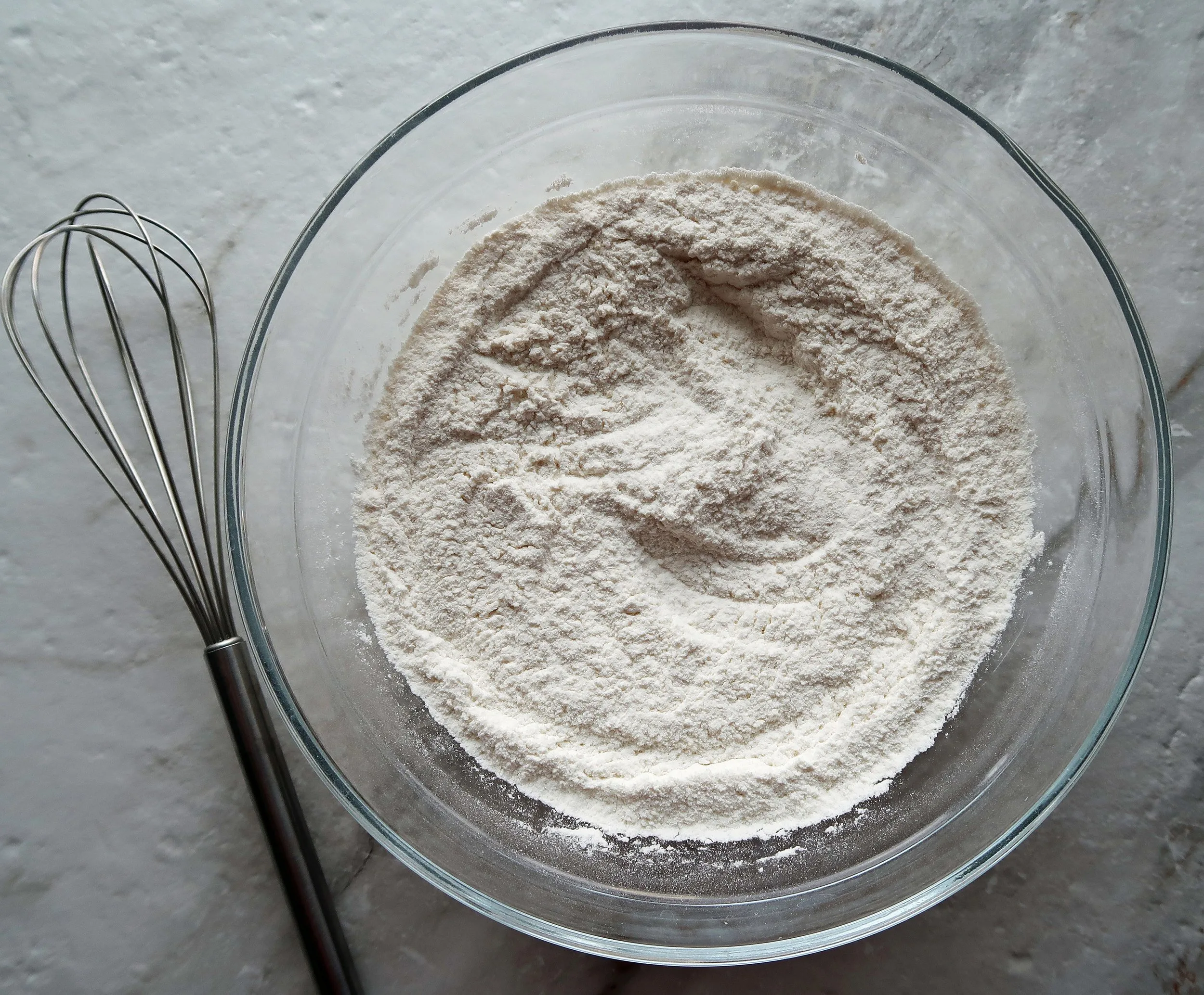 Flour, parmesan, baking powder, sugar, and salt in a bowl.