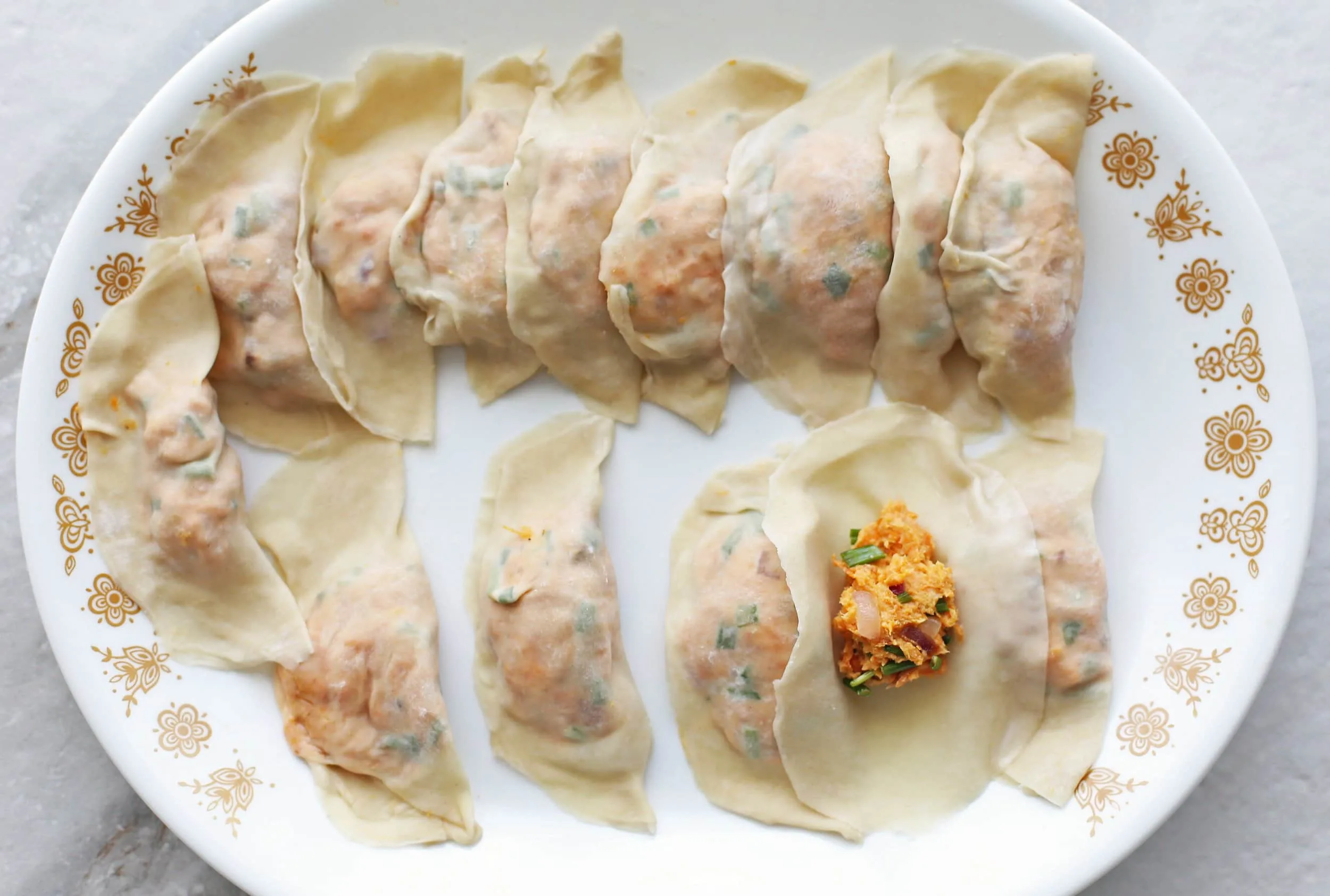Dumpling wrappers filled sweet potato cream cheese filling.