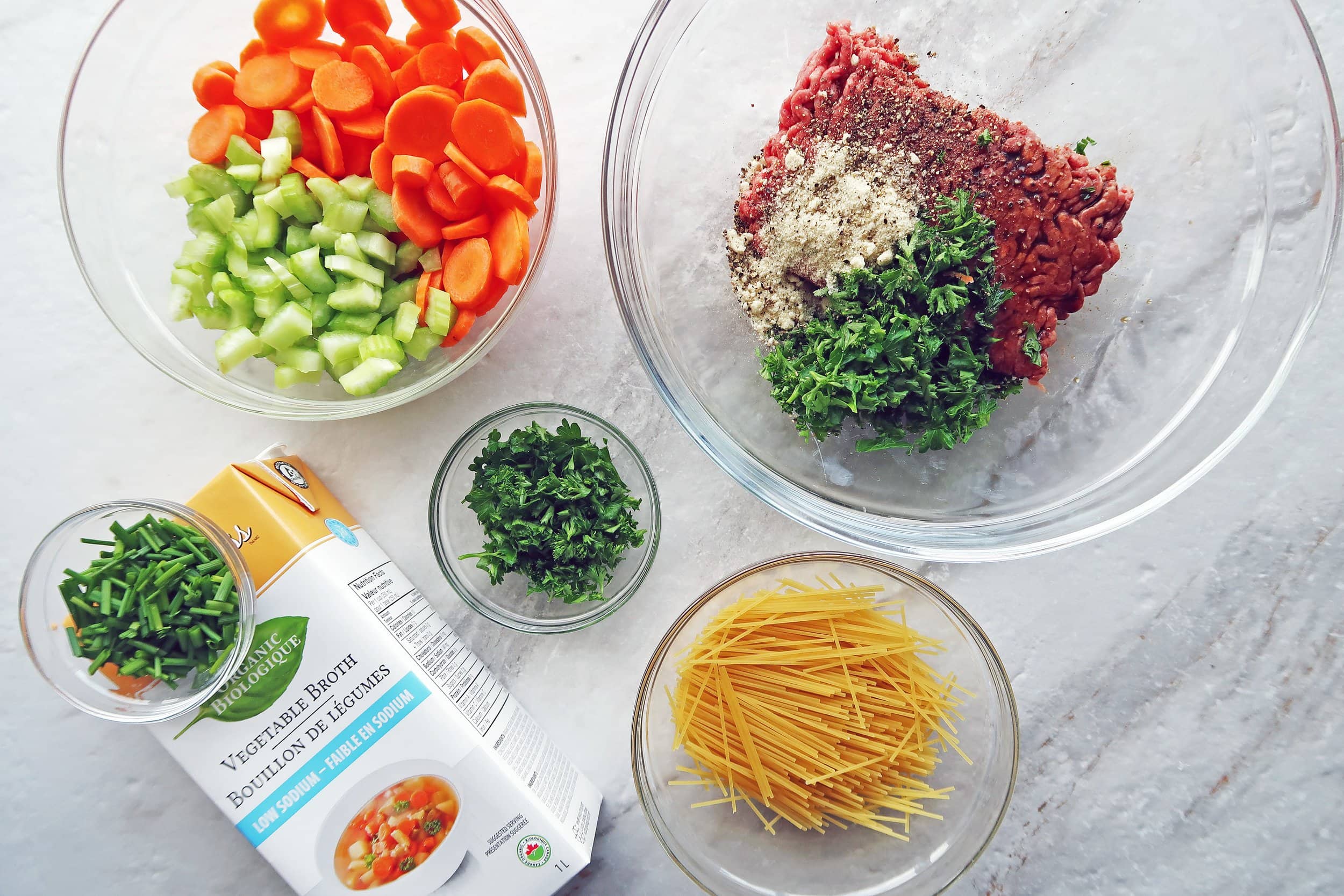 Ground beef, parsley, carrots, celery, pasta, and vegetable broth.