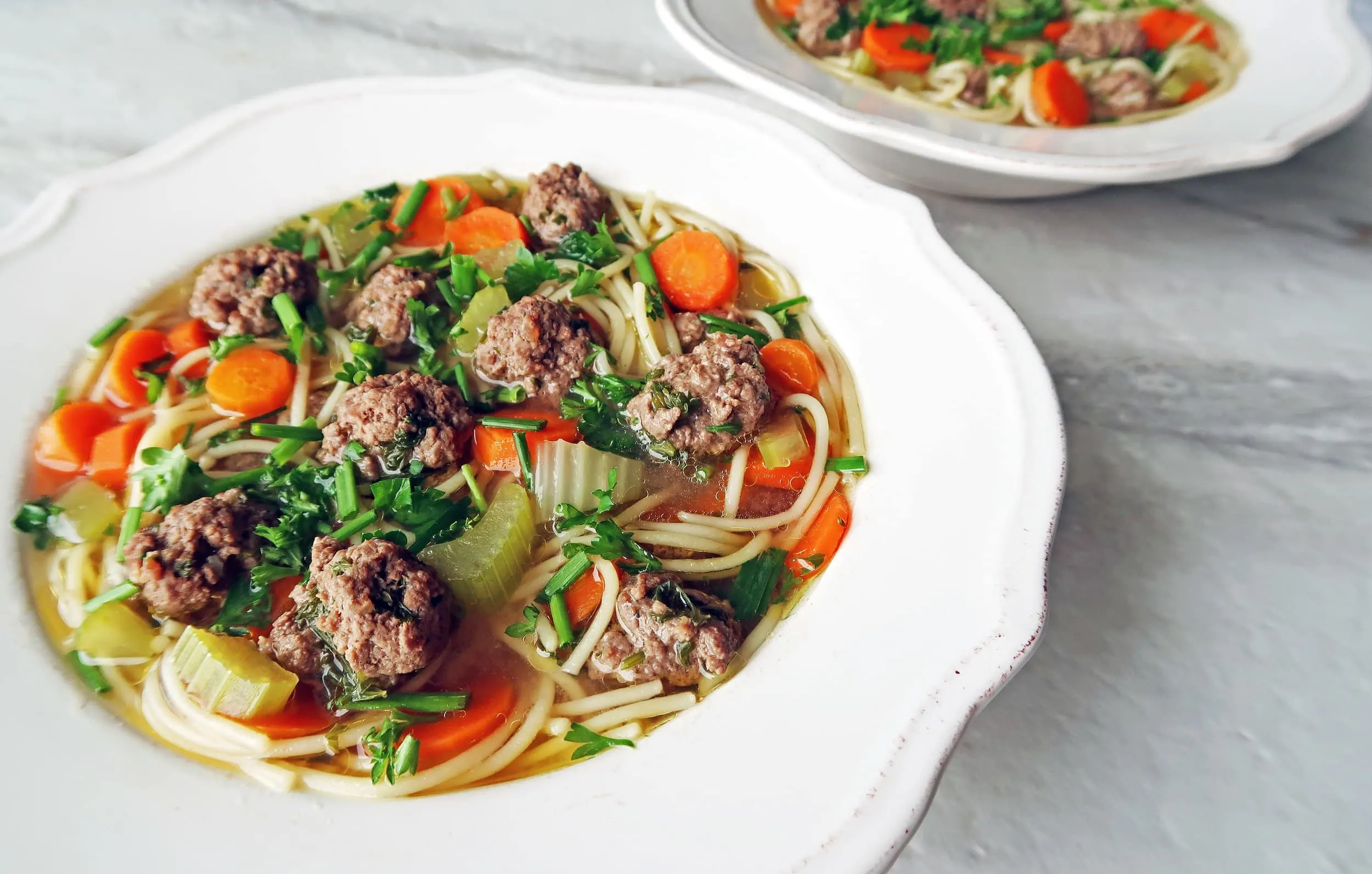 Two bowls of Dutch Vegetable Soup with Meatballs