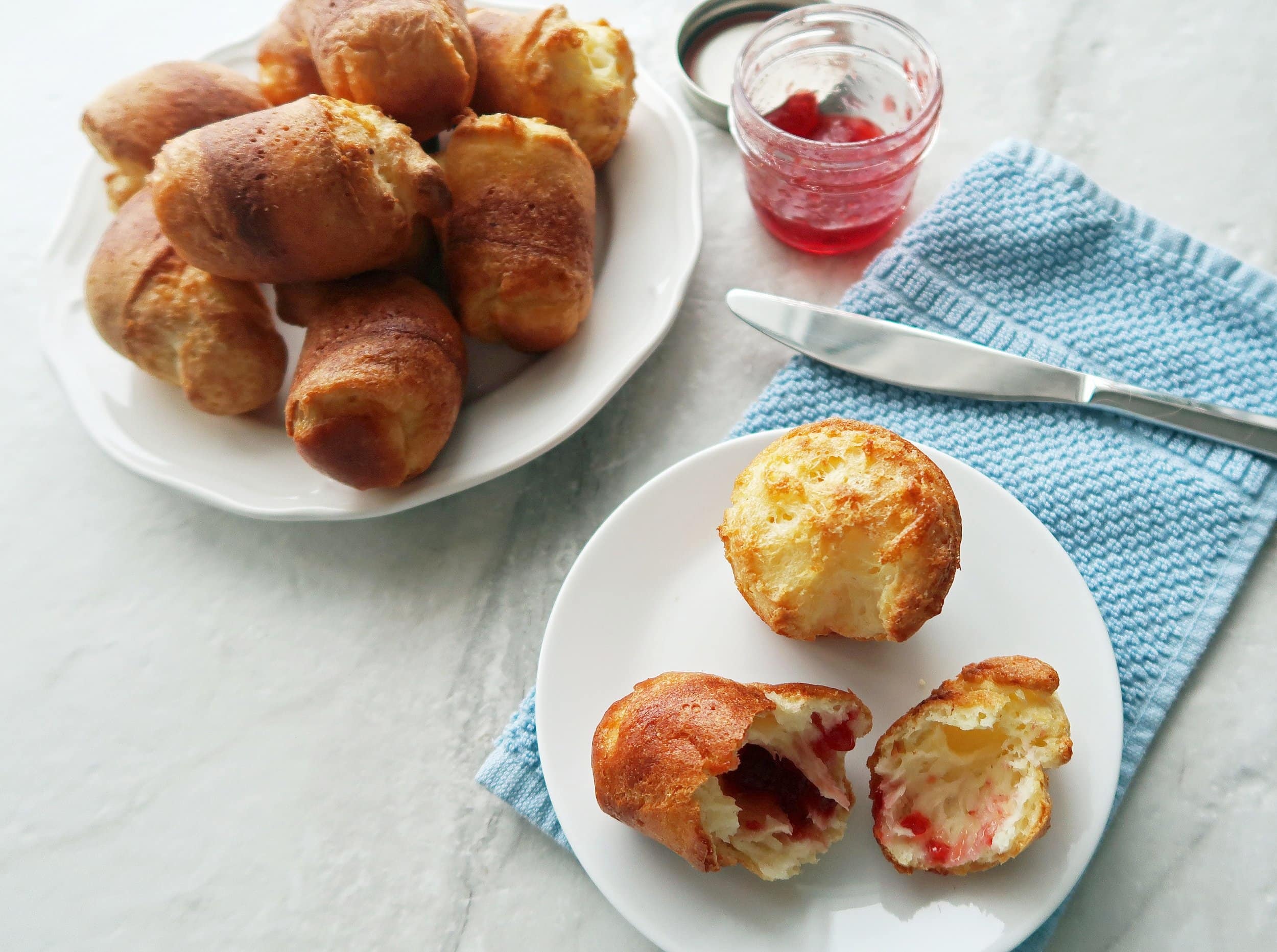 A plate of popovers with jam.