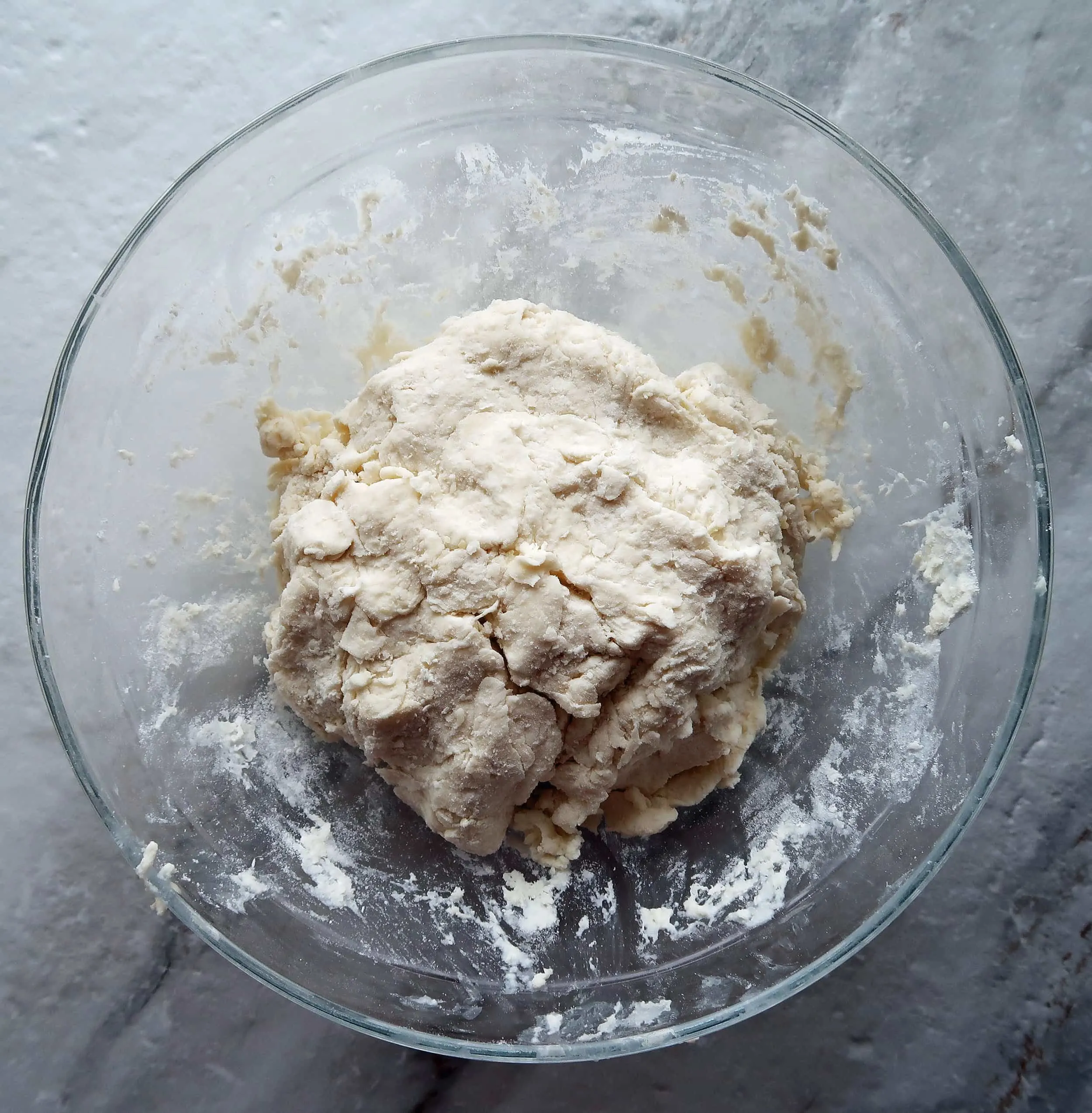 Pizza roll dough in a glass bowl.