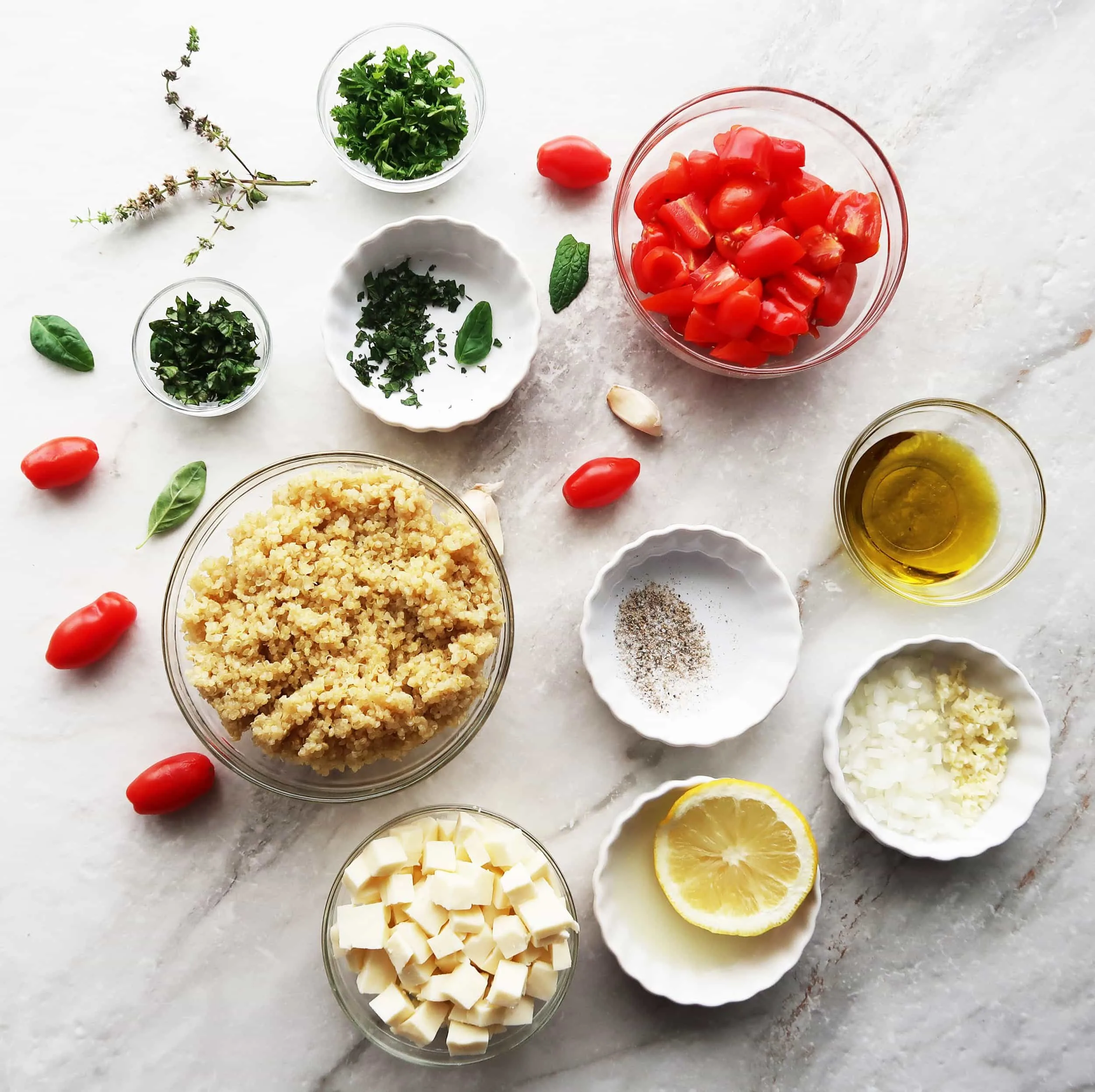 Quinoa, mozzarella, tomatoes, olive oil, herbs, and lemon.