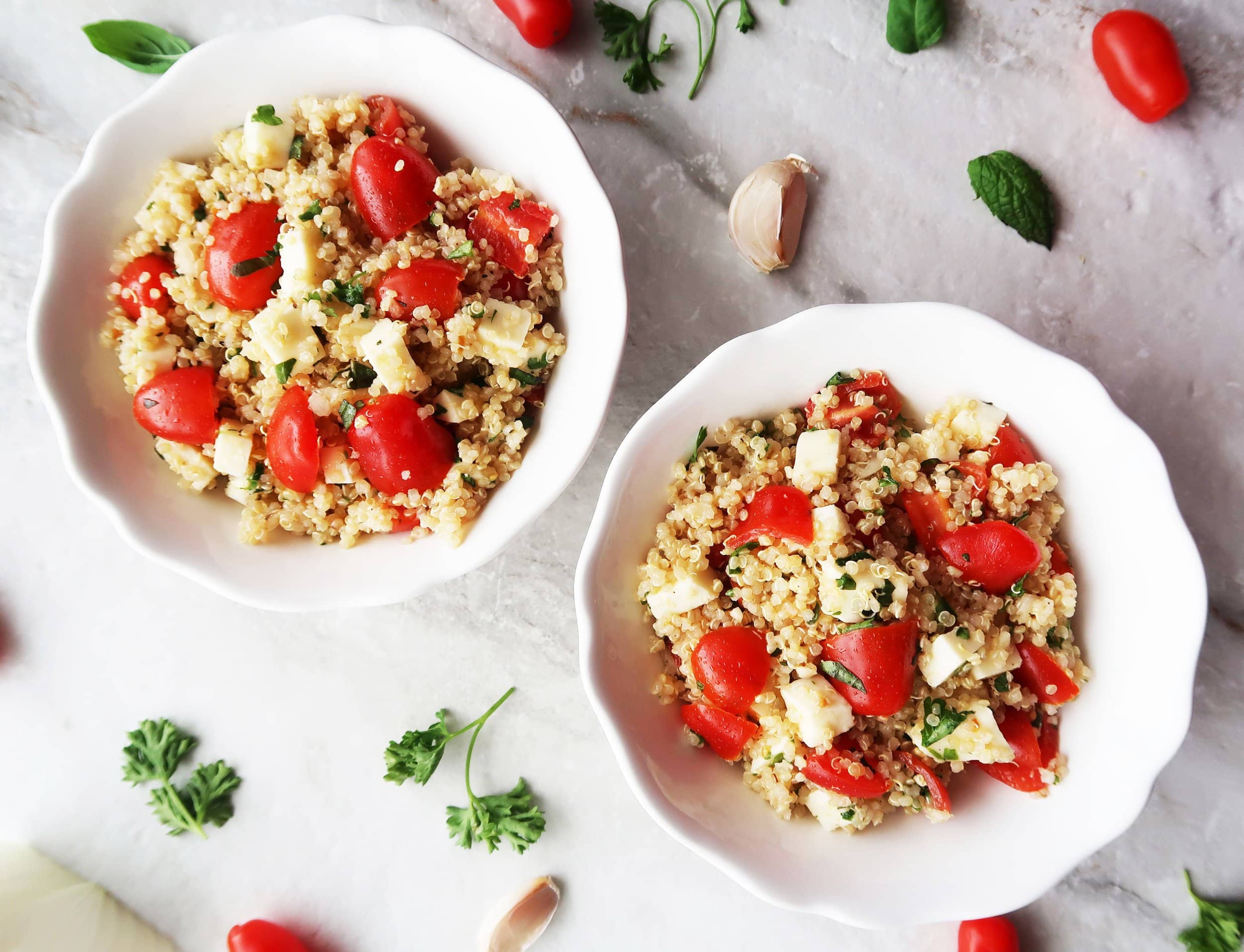 Two bowls of Fresh Tomato, Mozzarella, and Herb Quinoa Salad