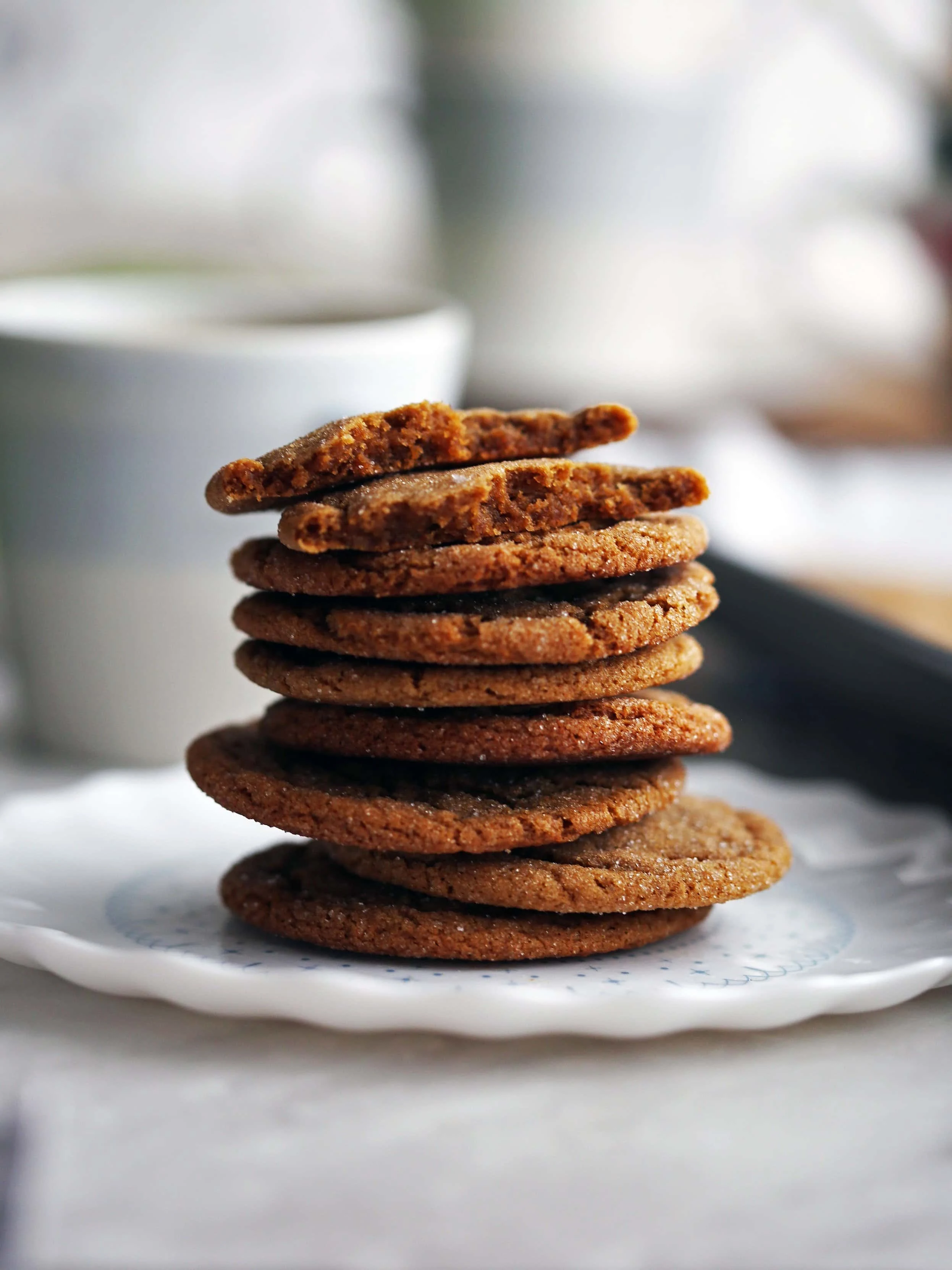 A closeup side view of a stack of chewy thin gingersnap (ginger molasses) cookies.