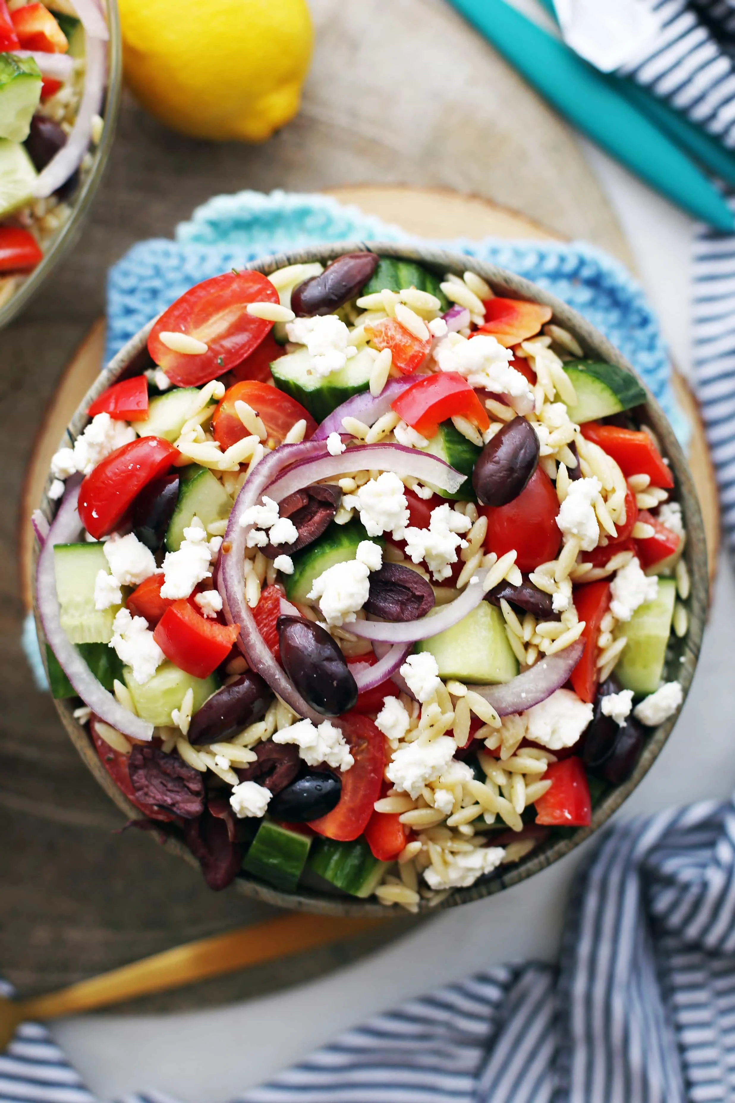 An overhead view of bowl of Greek Orzo Salad with Lemon Vinaigrette.