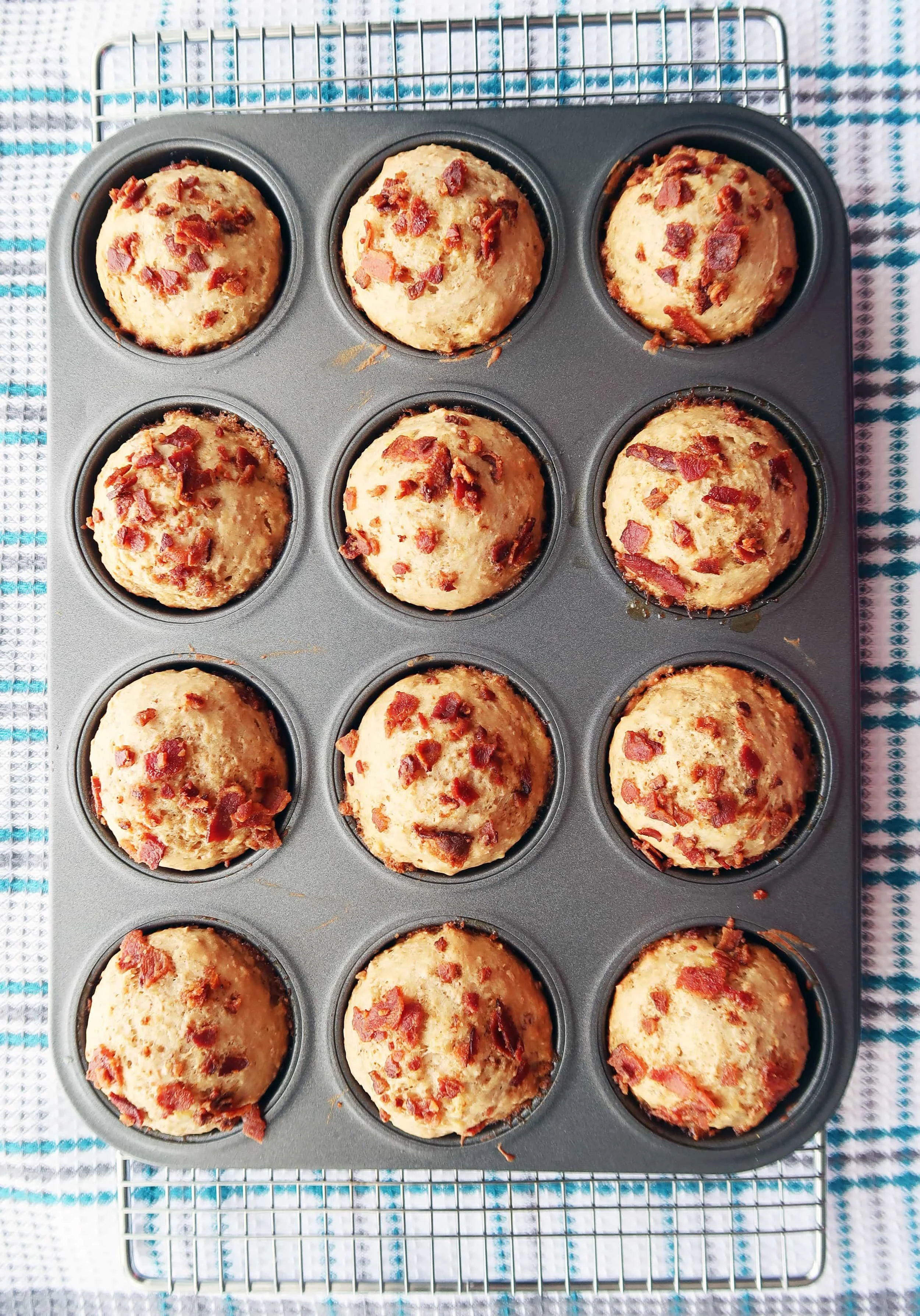 Healthier Maple Bacon Banana Muffins cooling on a rack.