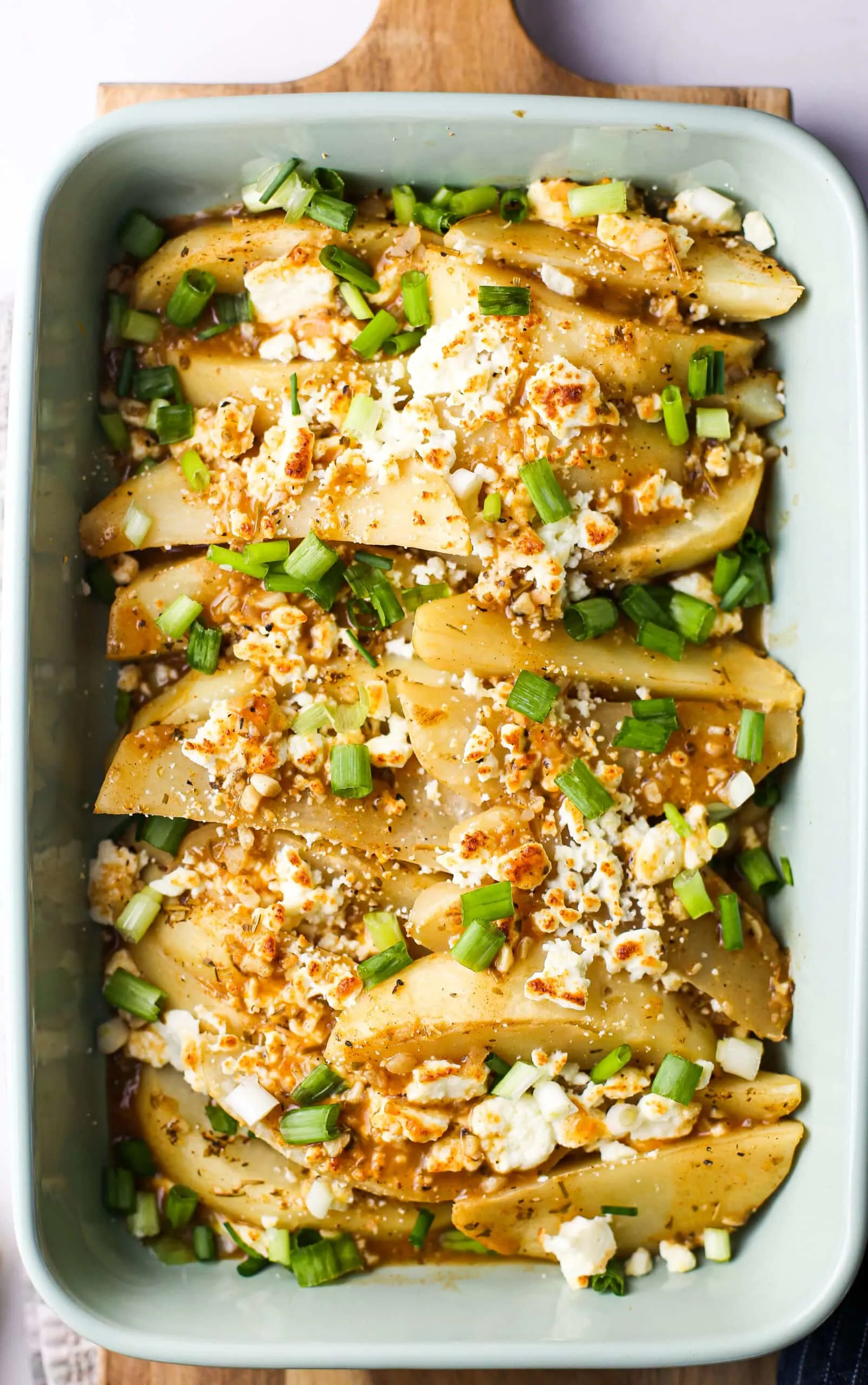 Overhead view of Instant Pot Lemon Feta Potatoes topped with green onions.