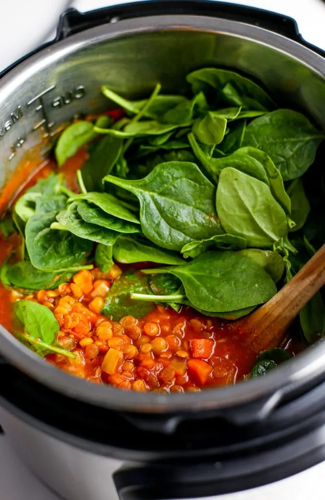 Turmeric lentil soup with fresh spinach in the Instant Pot.