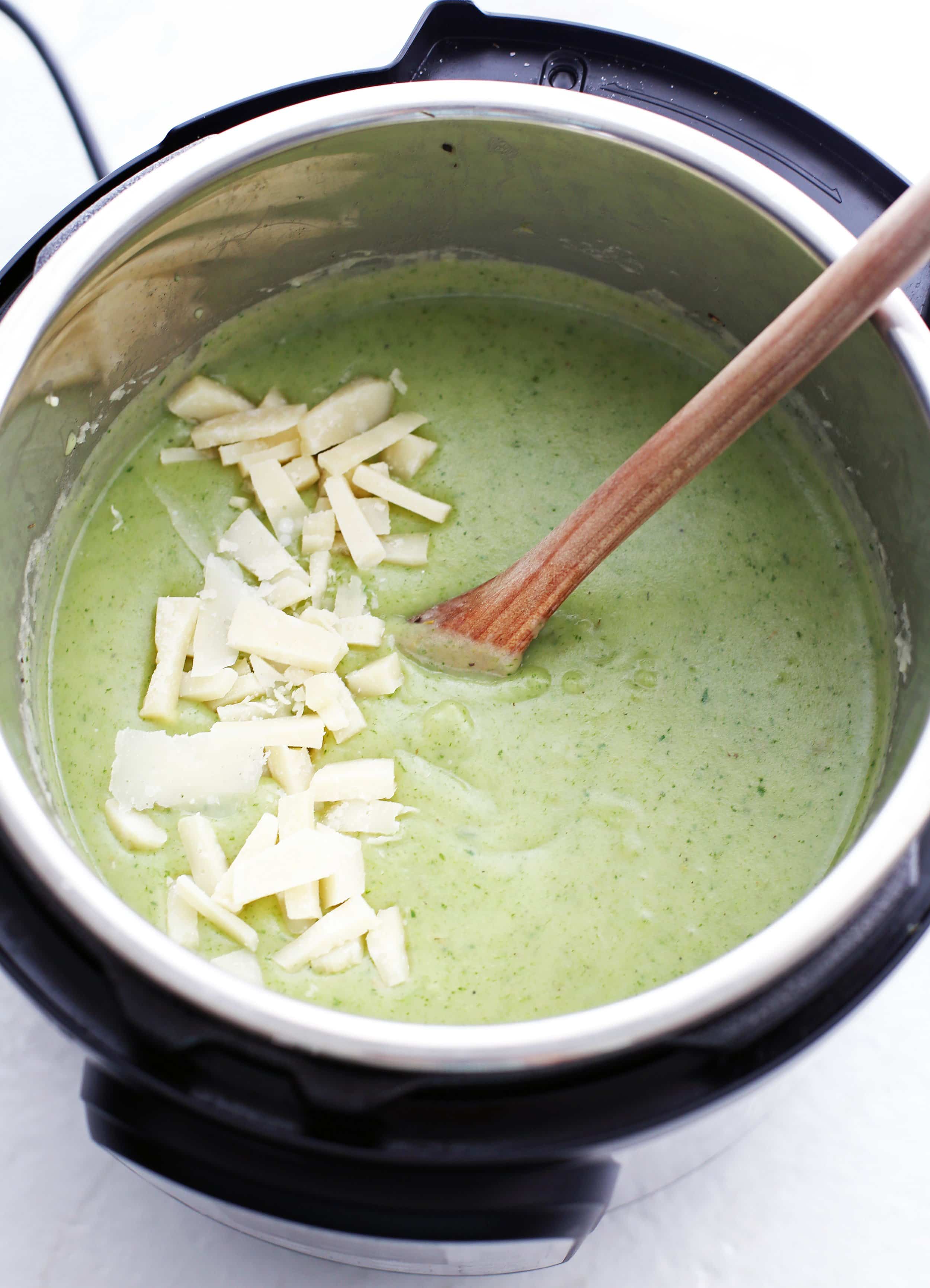 Creamy, light green Potato Leek Soup with Parmesan and Spinach in the Instant Pot.