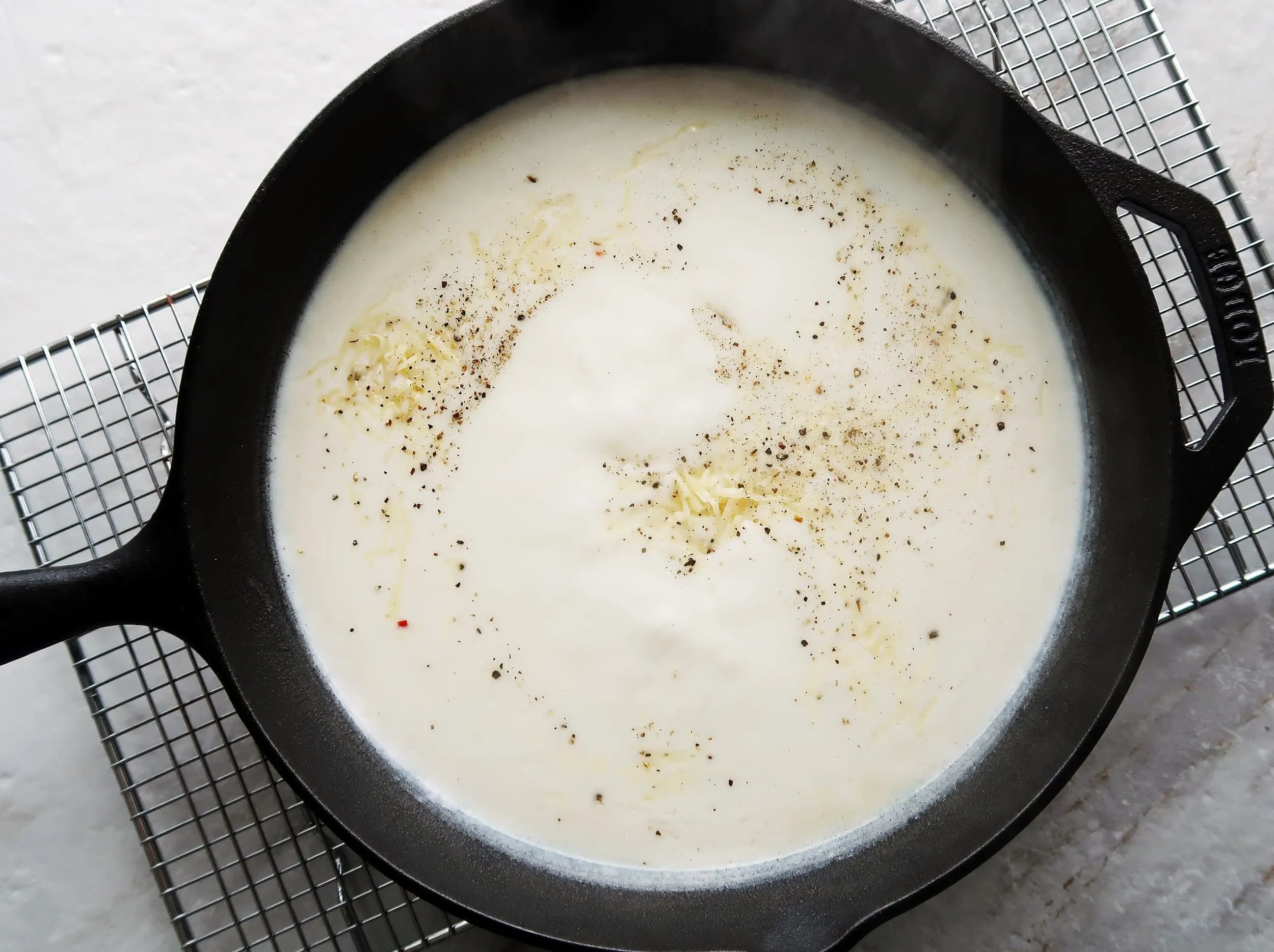 Milk in a cast iron skillet.