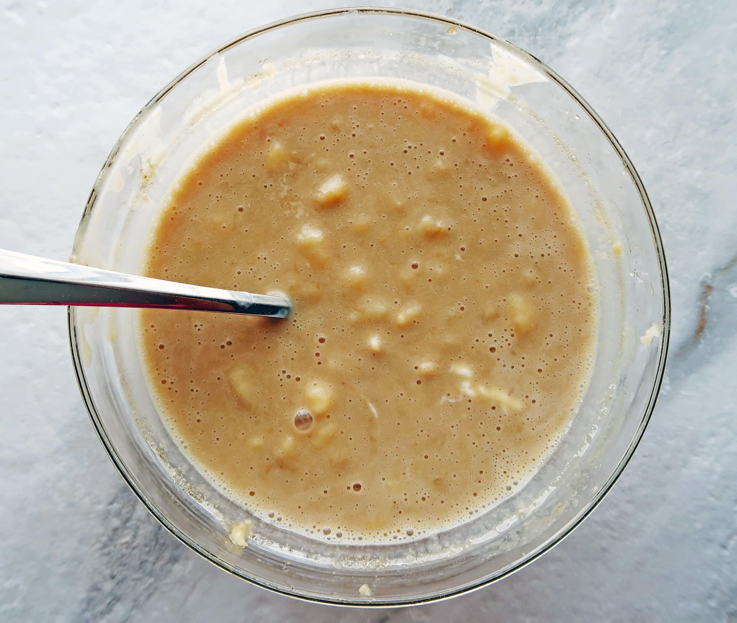 Wet ingredients for muffin batter in a bowl.