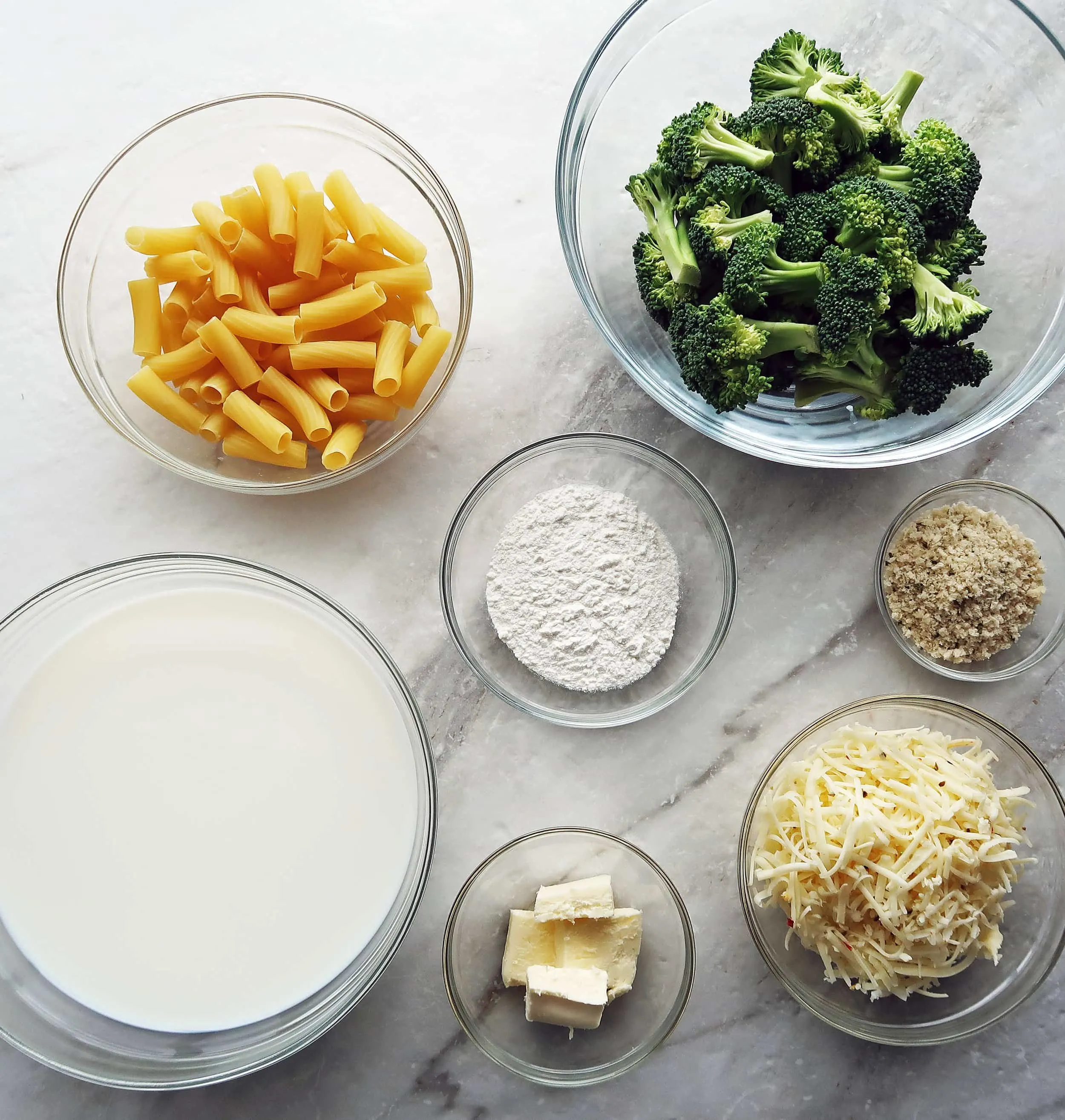 Pasta, broccoli, milk, butter, cheese, flour, and breadcrumbs.