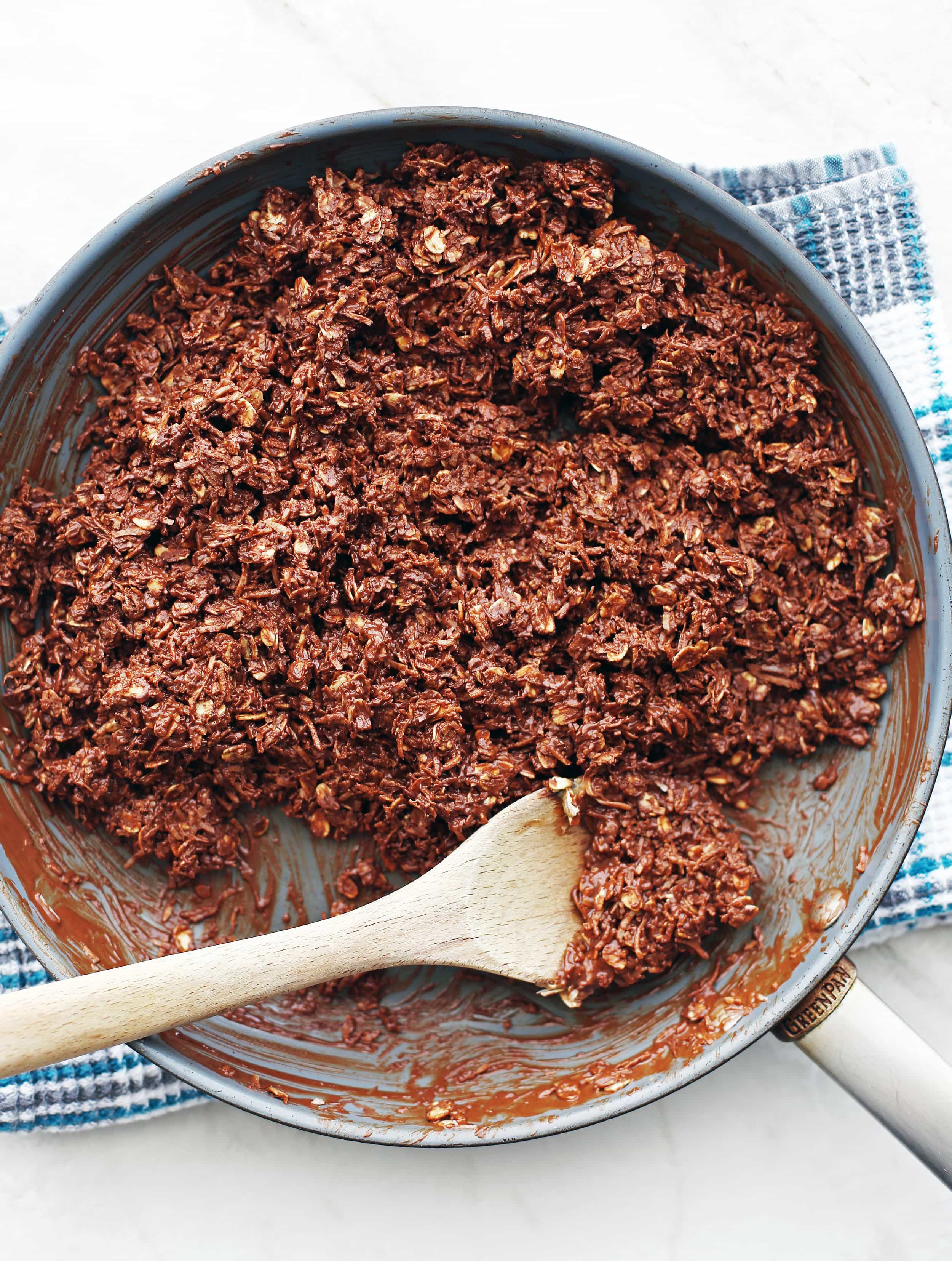 Rolled oats and shredded coconut mixed with melted chocolate and peanut butter.