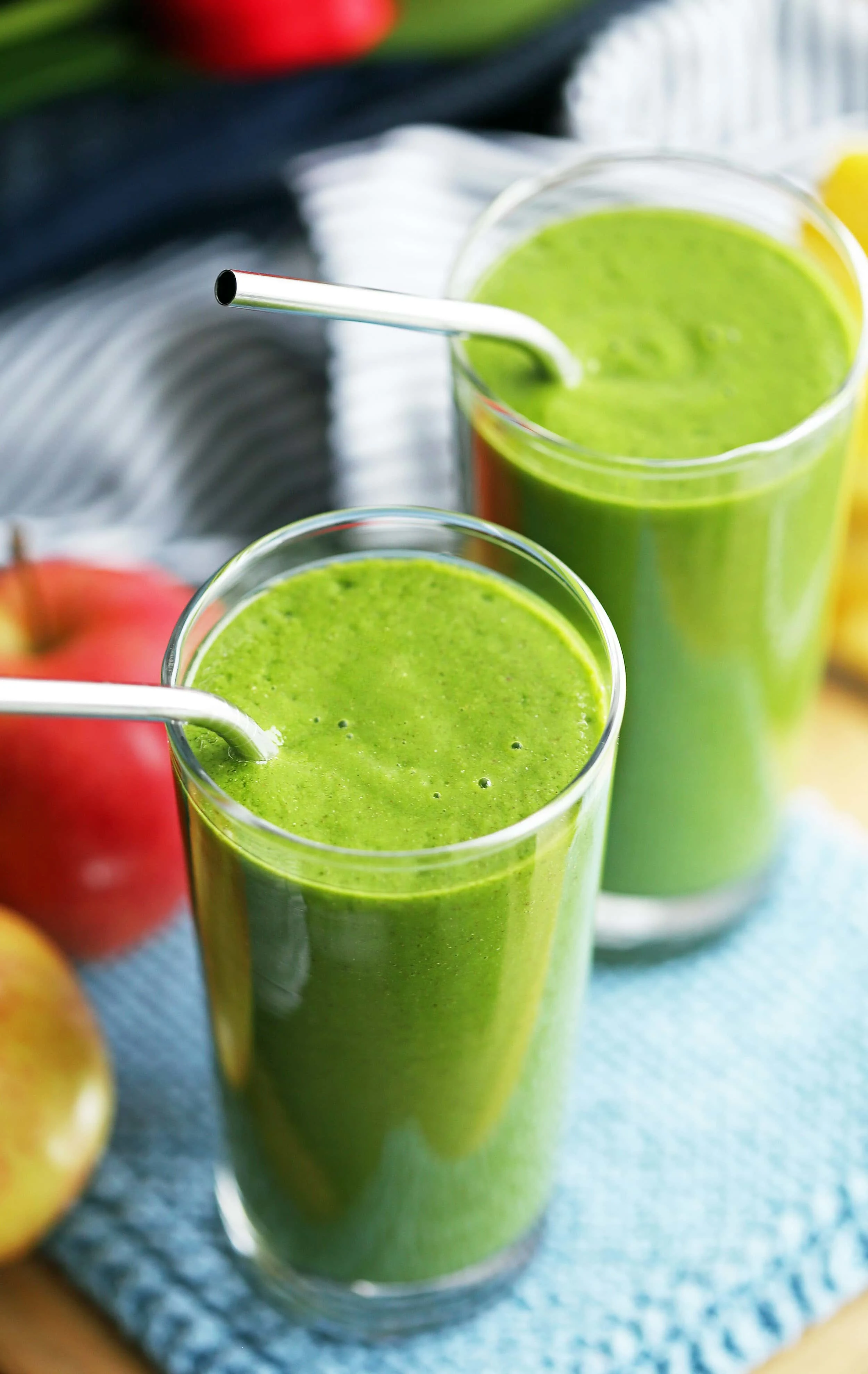 Two tall glasses filled with Kale Pineapple Chia Smoothies.