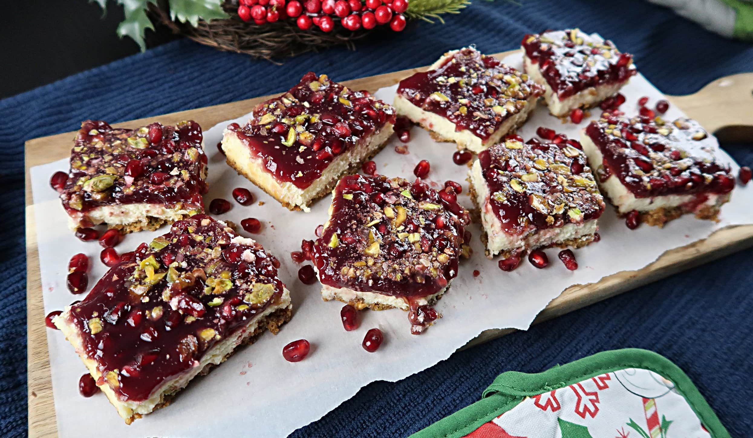 Cheesecake bars cut into squares.