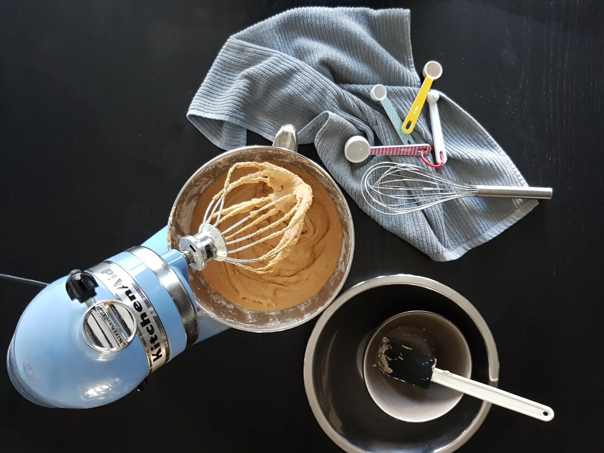 The batter for a Pumpkin Sour Cream Coffee Cake in a stand mixer.