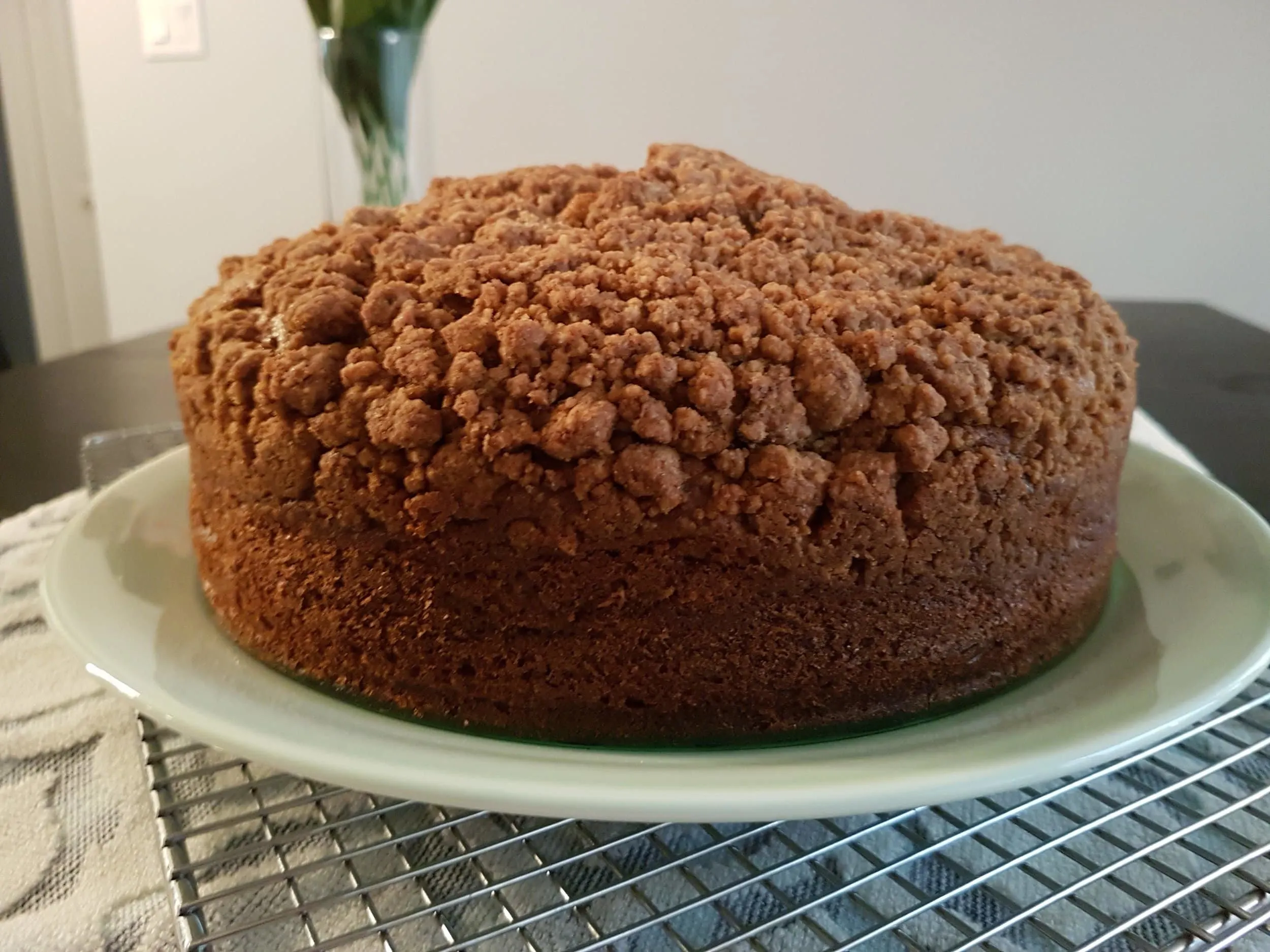 A whole Pumpkin Sour Cream Coffee Cake complete with crumble topping.