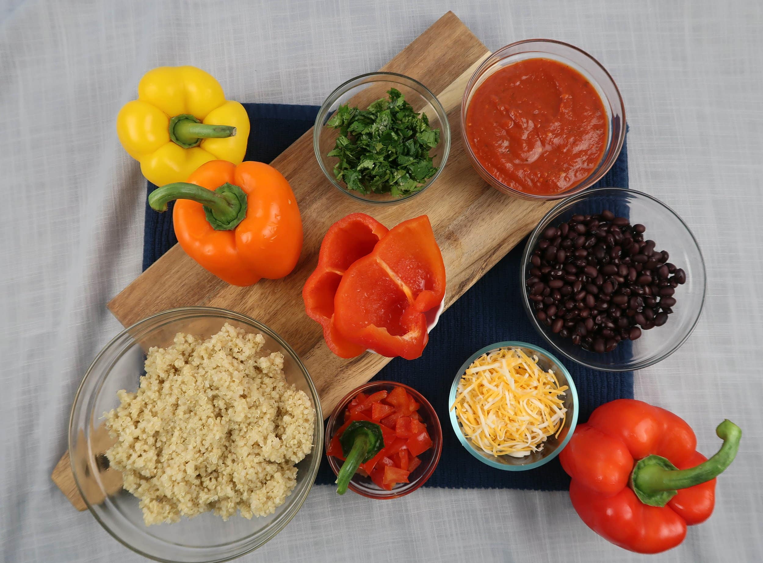 Quinoa, bell peppers, black beans, crushed tomatoes, cheese, and cilantro.