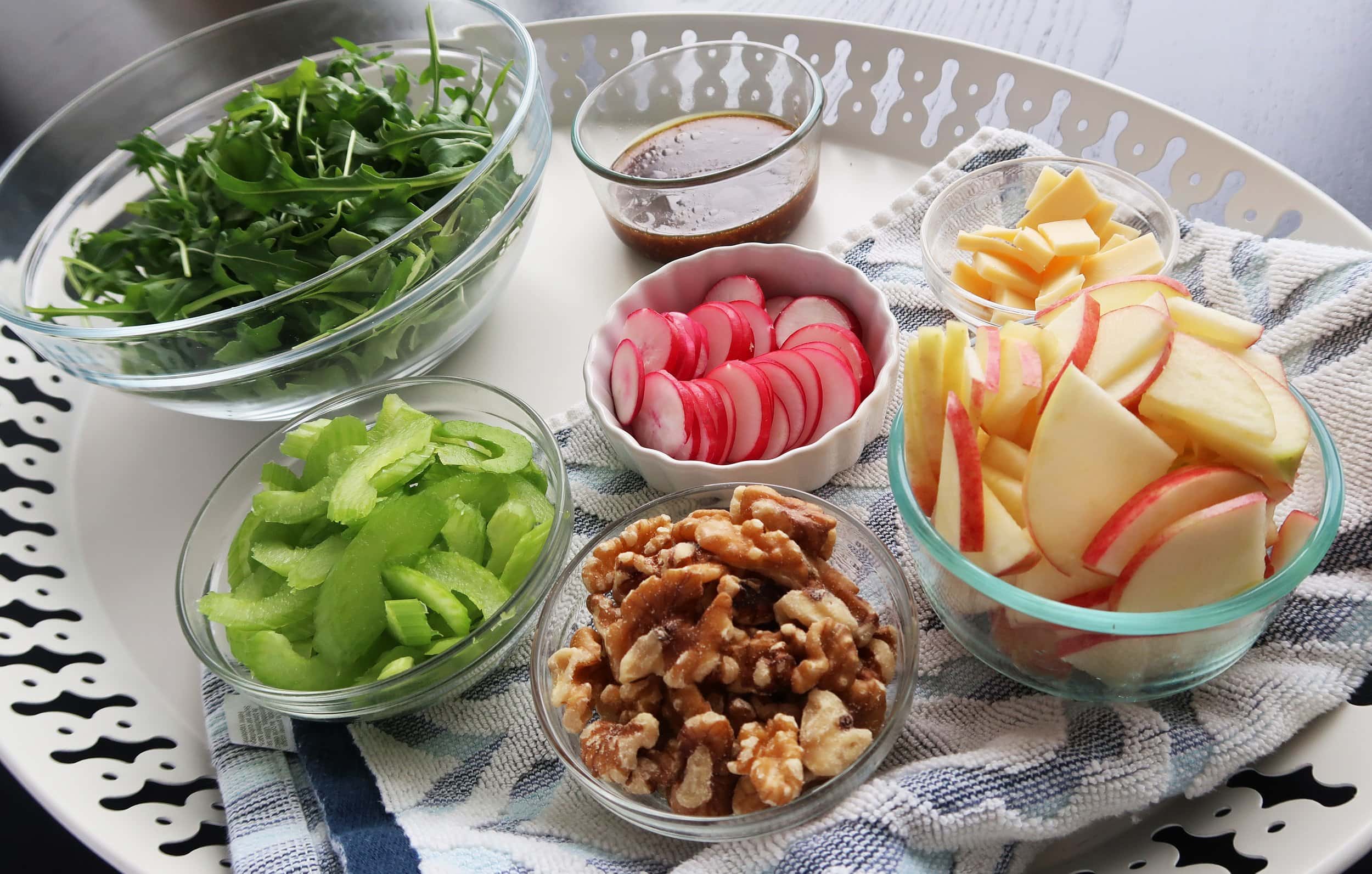 Arugula, celery, radishes, apples, walnuts, and dressing.