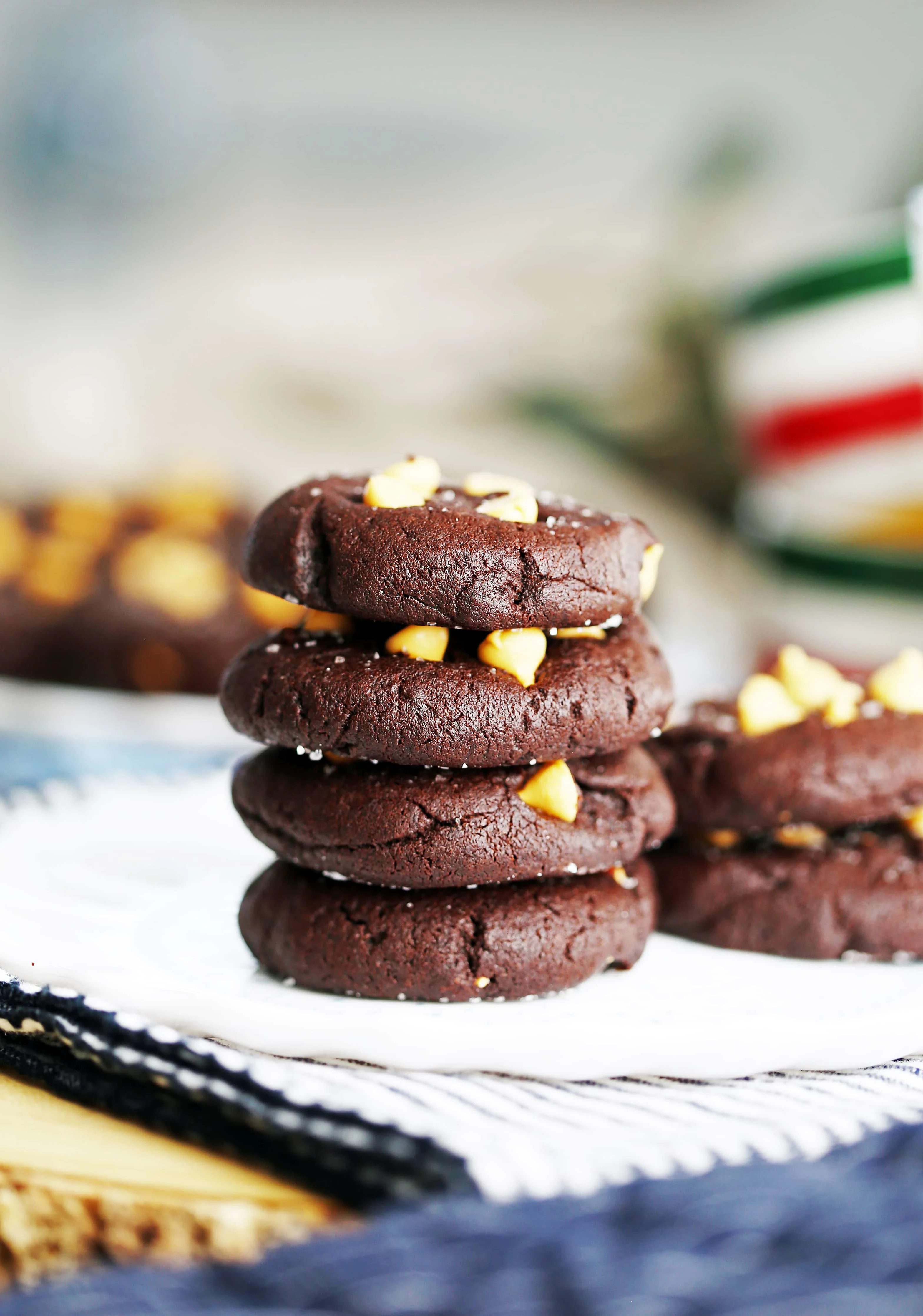 Salted chocolate cookies pilled on a white plate.